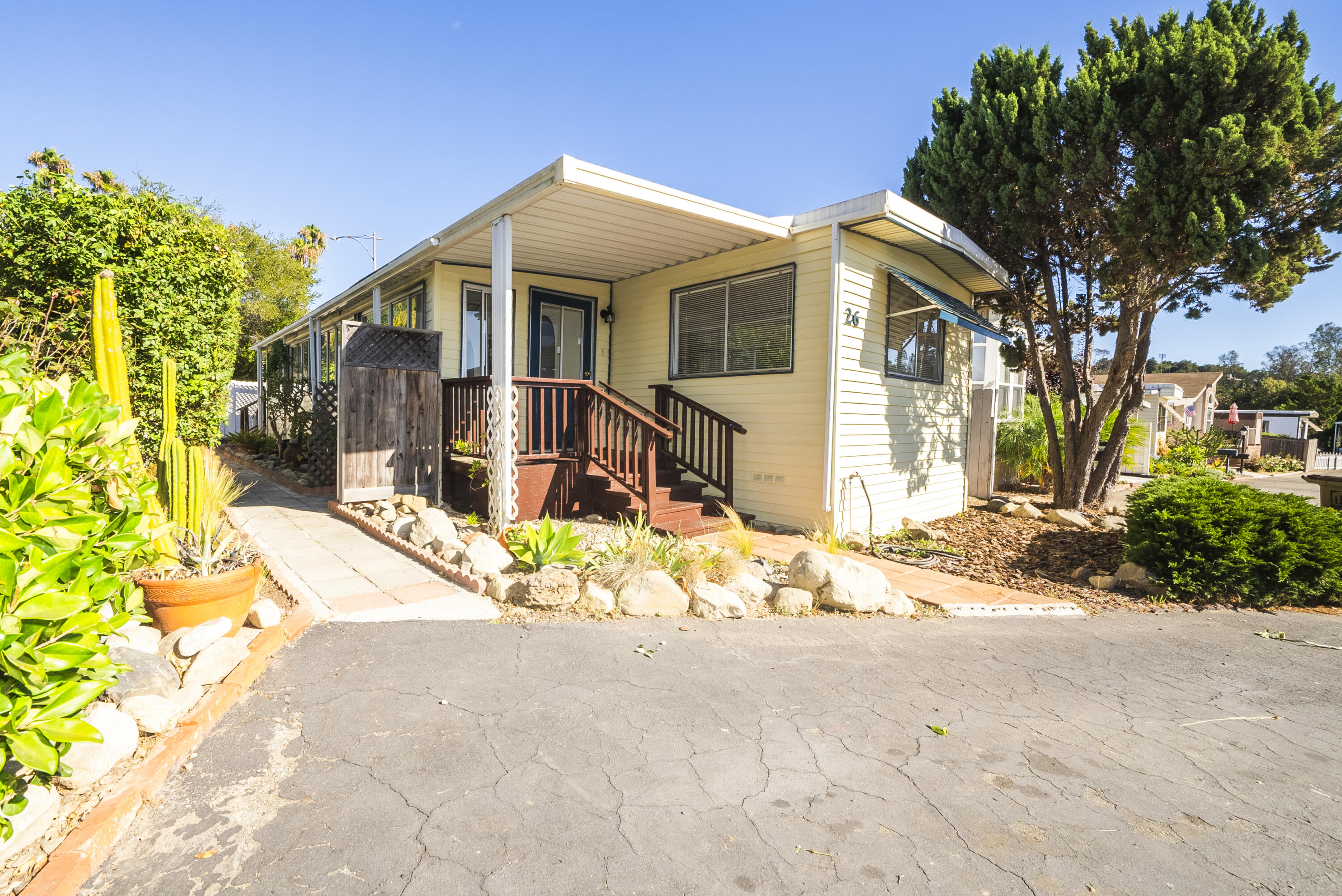 4025 State Street, Unit 26 Santa Barbara, CA 93110 - Photo 2 of 20 a view of a house with a yard and tree s