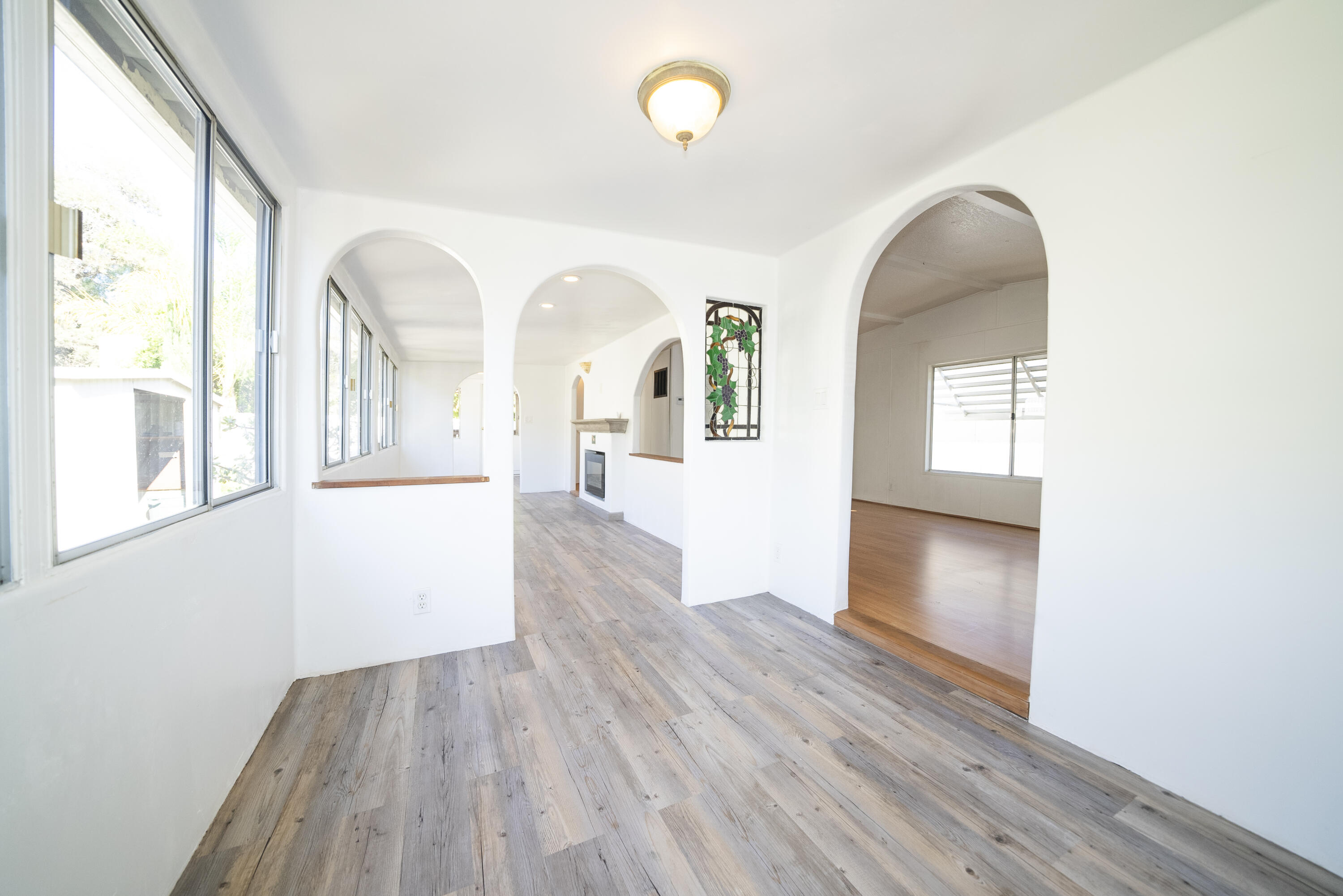 4025 State Street, Unit 26 Santa Barbara, CA 93110 - Photo 3 of 20 wooden floor in an empty room with a window