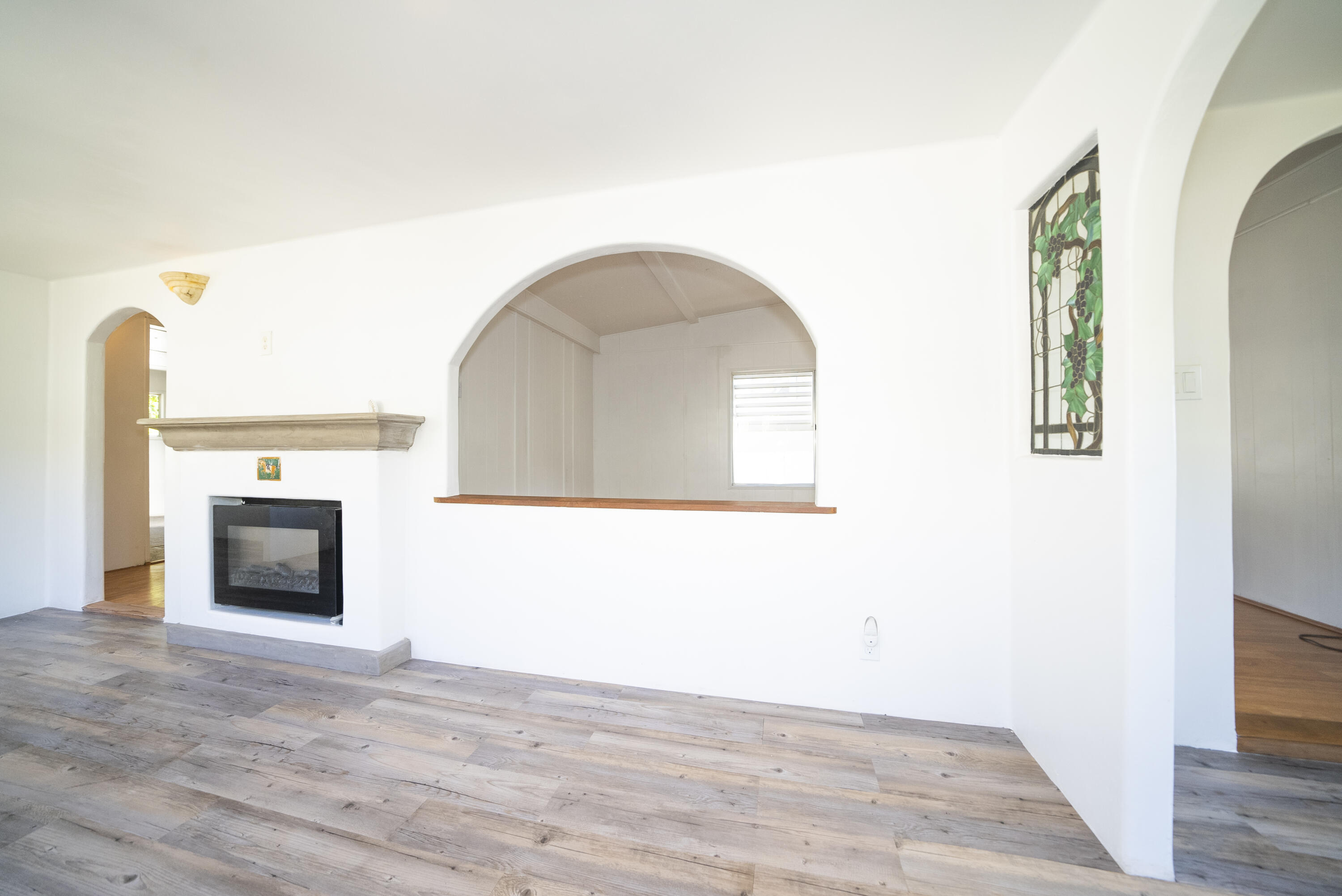 4025 State Street, Unit 26 Santa Barbara, CA 93110 - Photo 6 of 20 a view of a livingroom with wooden floor and a fireplace