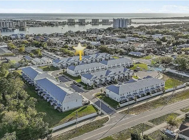 an aerial view of residential houses with outdoor space