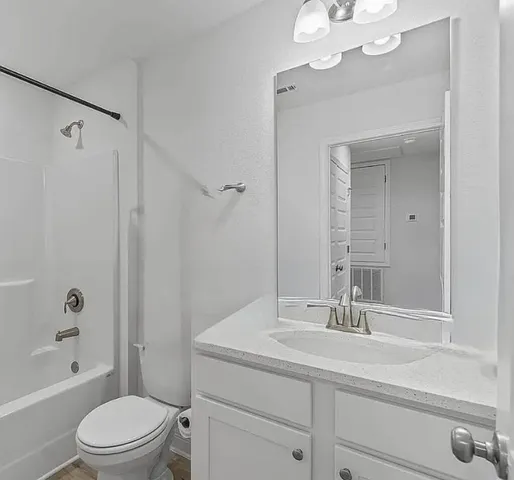 a bathroom with a toilet and a bathtub