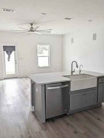 a bathroom with a sink vanity and mirror