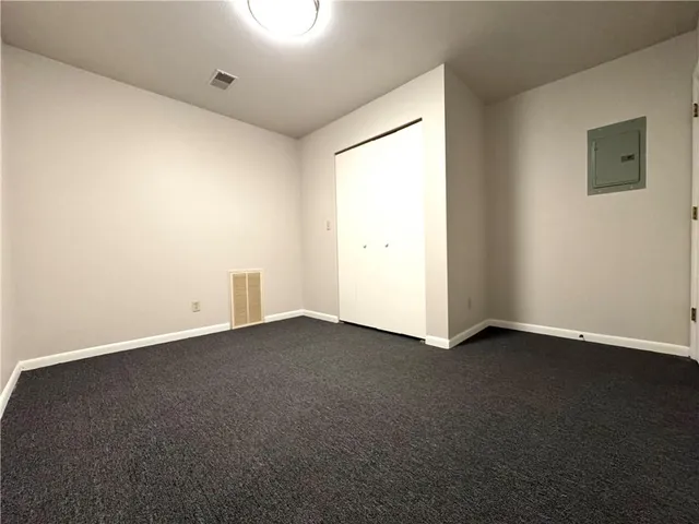 a view of an empty room and a window