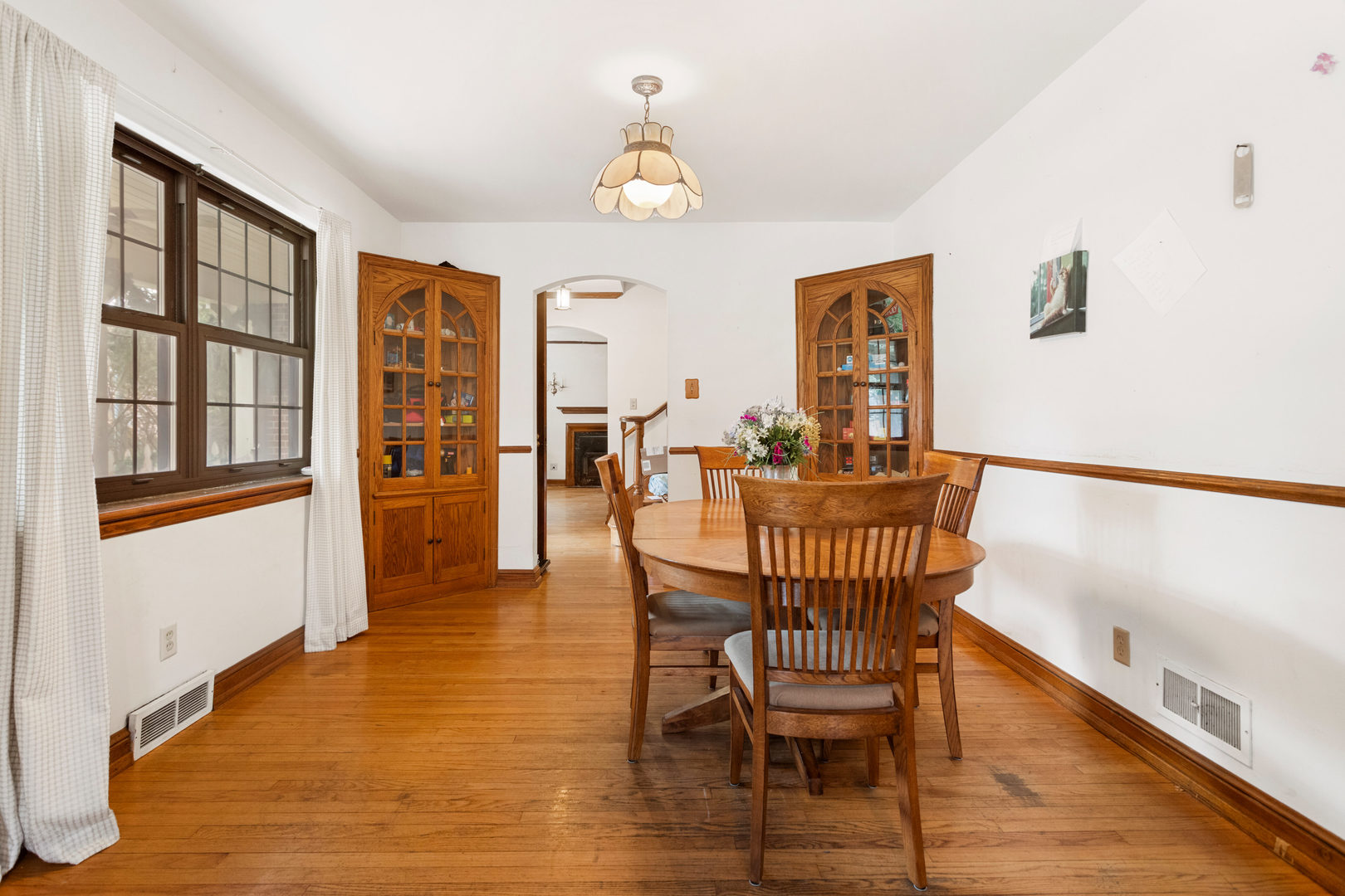 901 West Green Street Champaign, IL 61821 - Photo 12 of 36 a dining room with furniture a chandelier and wooden floor