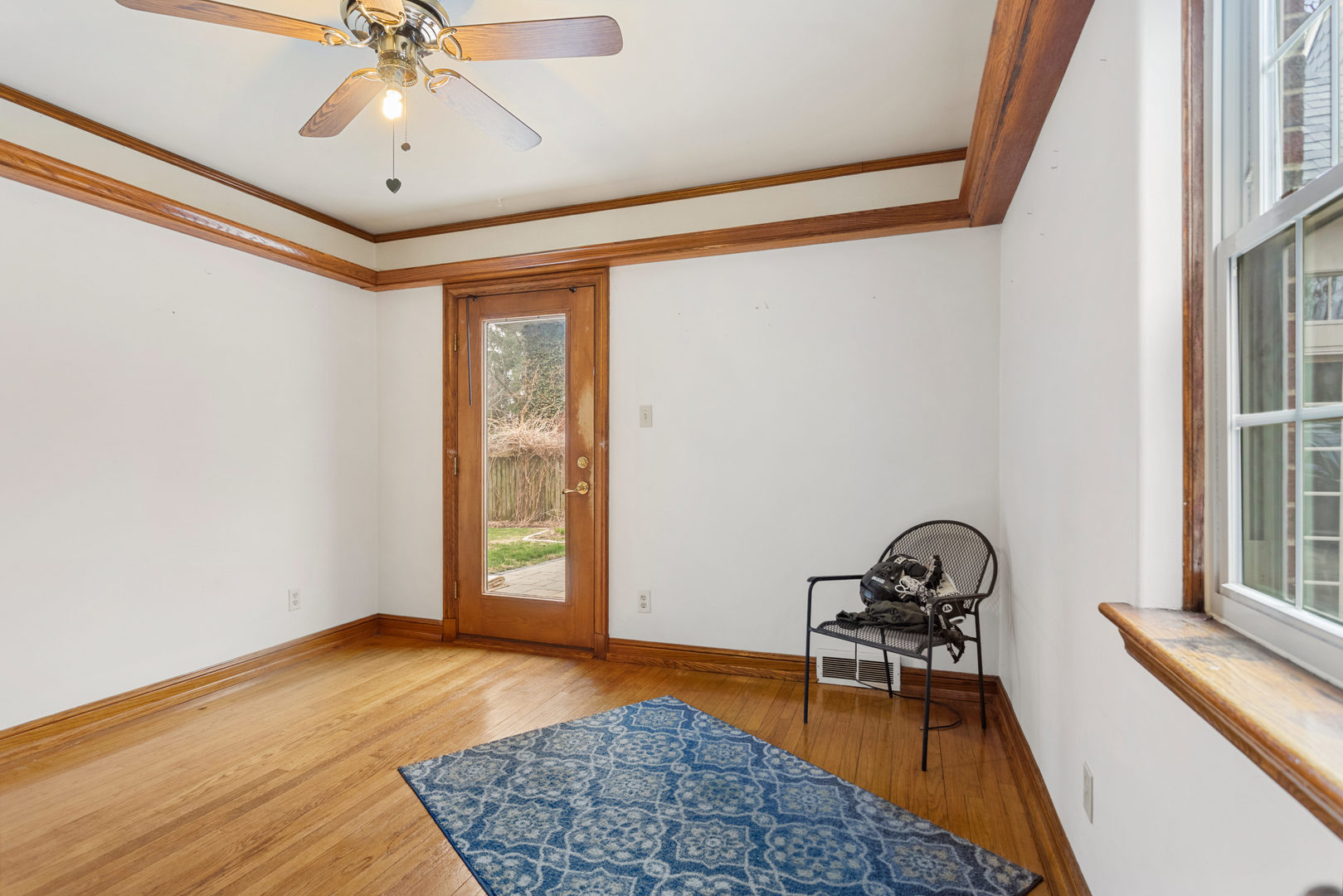 901 West Green Street Champaign, IL 61821 - Photo 20 of 36 a view of a room with window and wooden floor