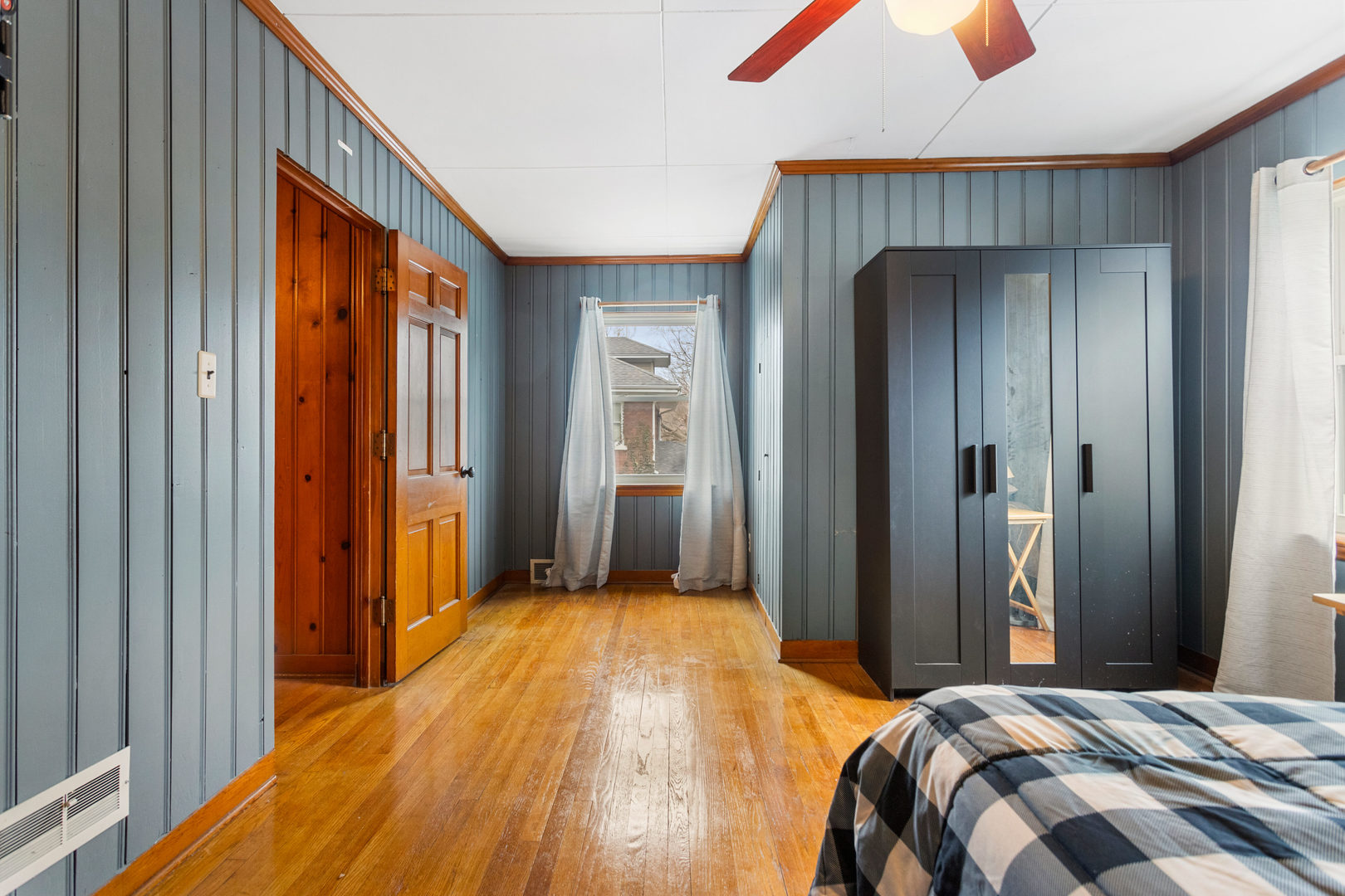 901 West Green Street Champaign, IL 61821 - Photo 24 of 36 a bedroom with a bed and a mirror