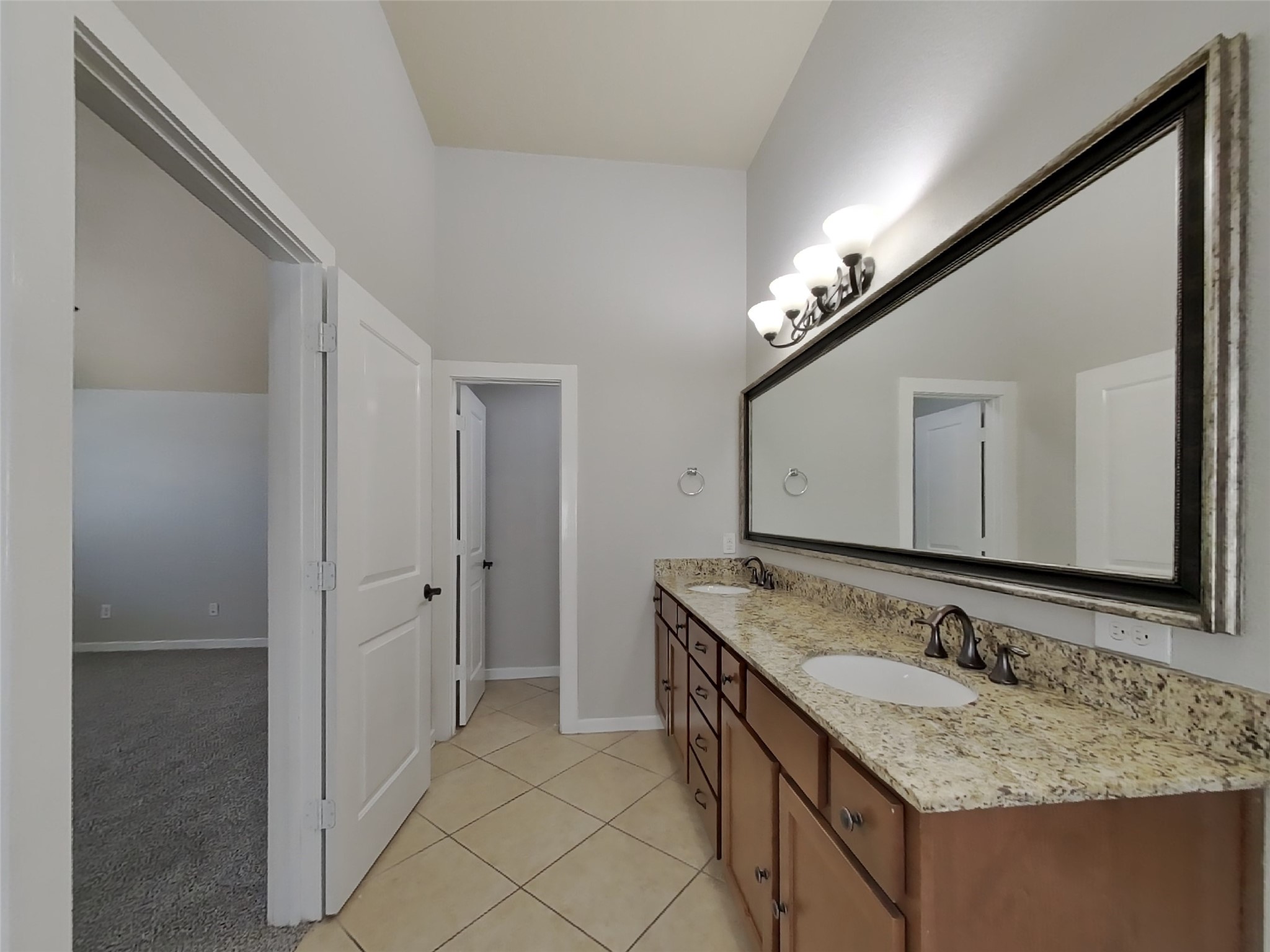 1819 Jara Court Spring, TX 77388 - Photo 8 of 19 a bathroom with a granite countertop sink and a mirror