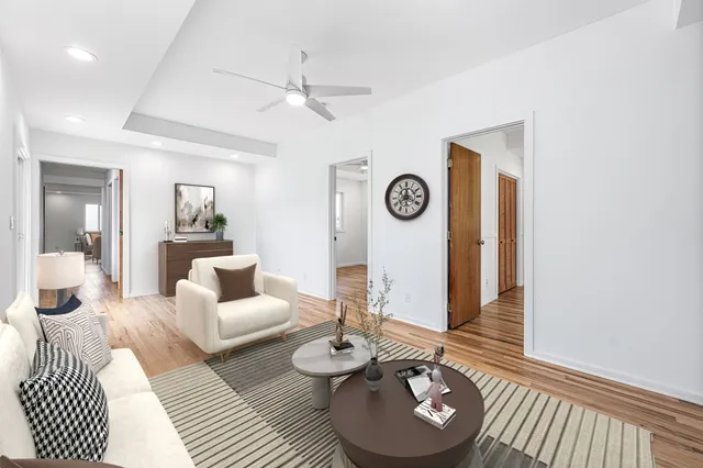 a living room with furniture and a table