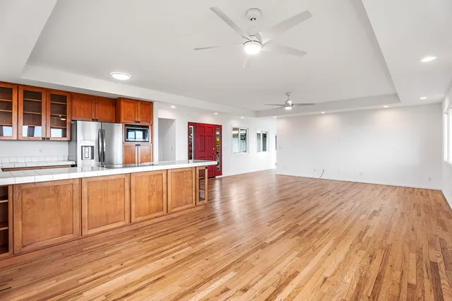 a view of a kitchen with wooden floor