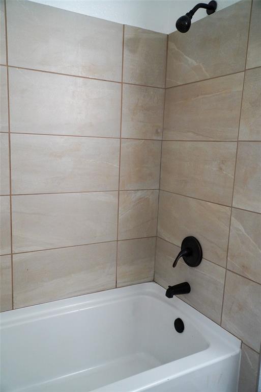 403 North Fairview Street Keene, TX 76059 - Photo 17 of 25 a bathroom with a tub