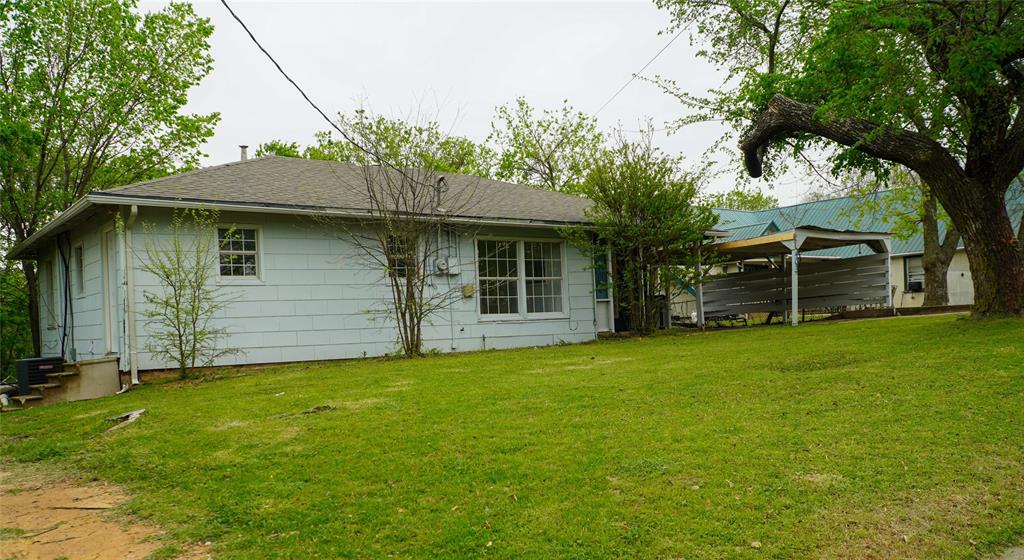 403 North Fairview Street Keene, TX 76059 - Photo 23 of 25 a front view of a house with a garden