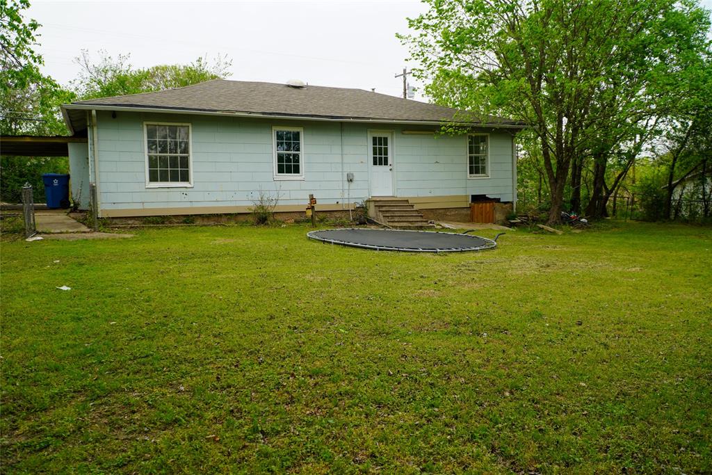 403 North Fairview Street Keene, TX 76059 - Photo 24 of 25 a view of a house with a backyard