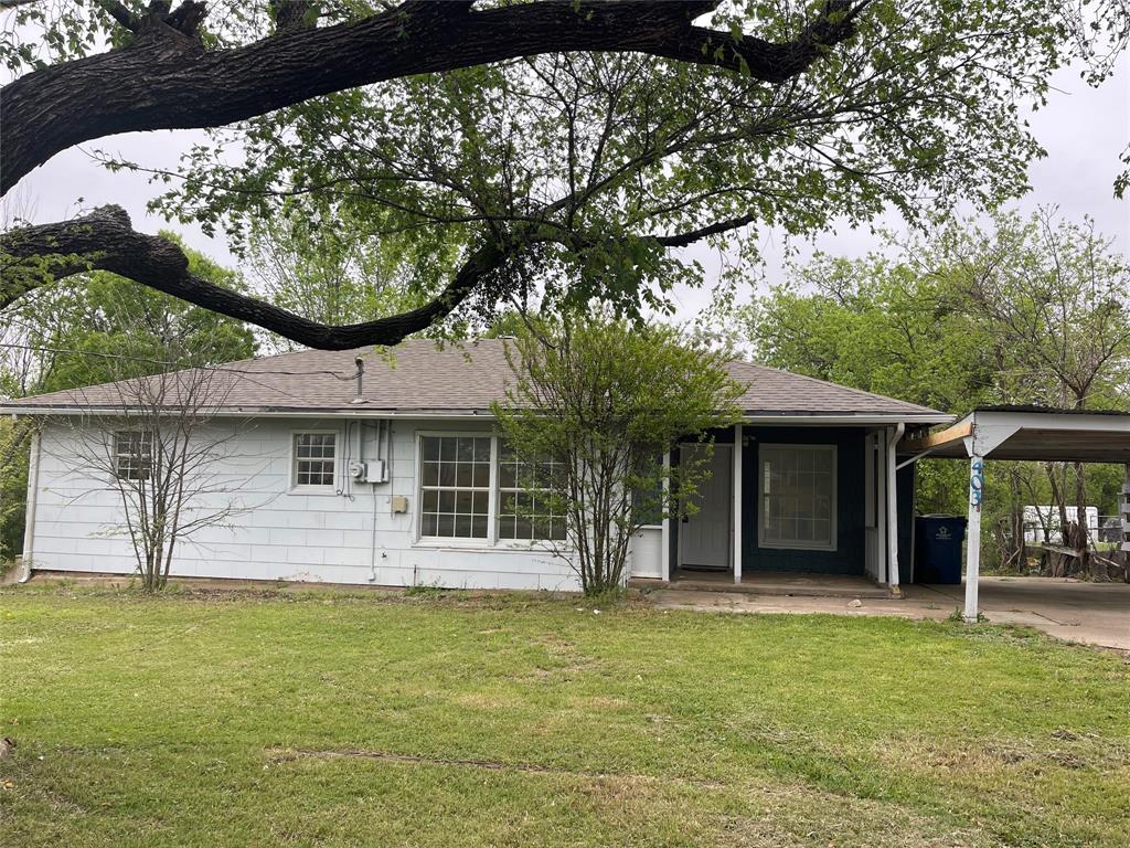 403 North Fairview Street Keene, TX 76059 - Photo 3 of 25 a front view of a house with garden