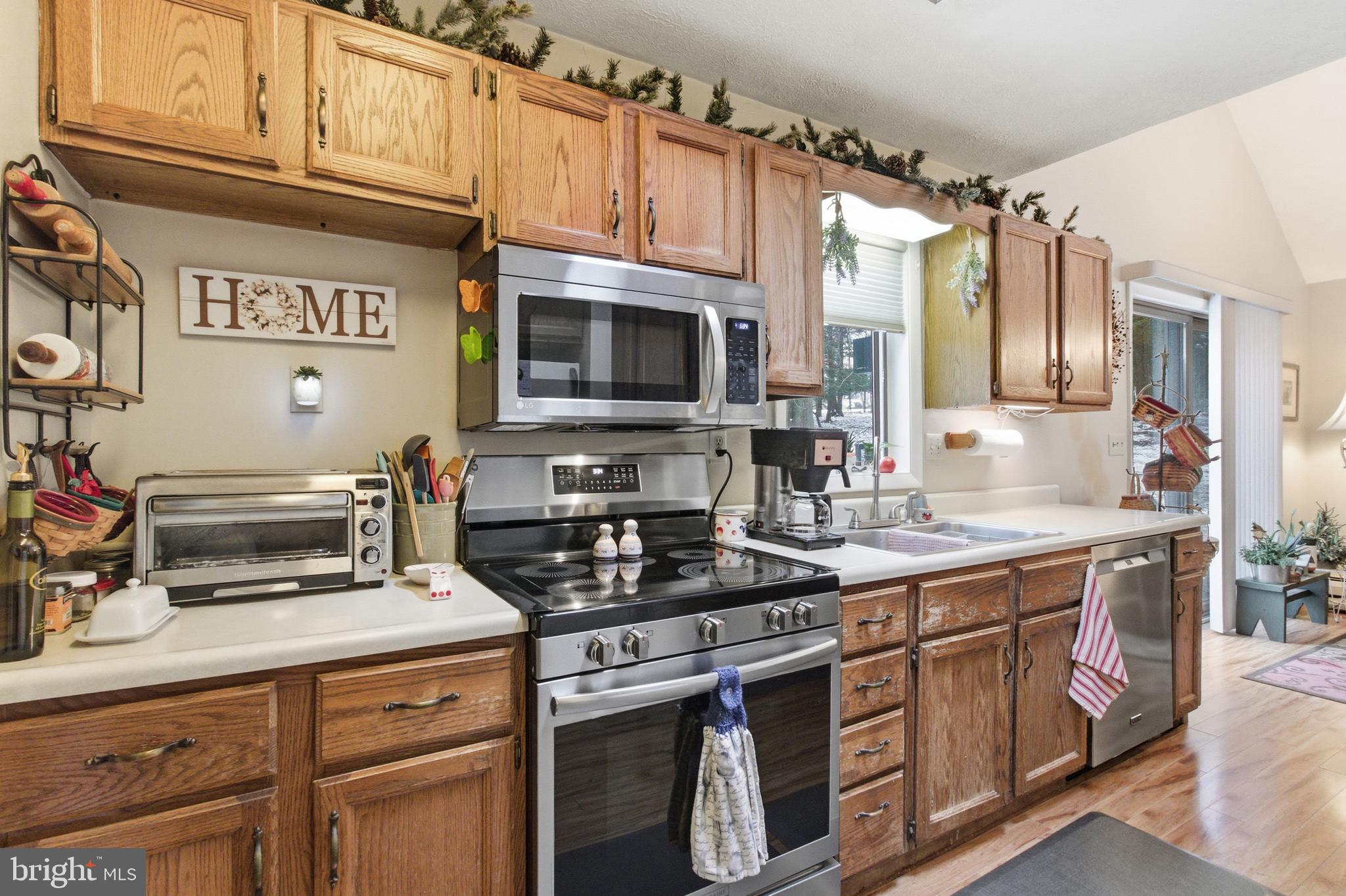 63 Sea Horse Road Du Bois, PA 15801 - Photo 22 of 35 a kitchen with stainless steel appliances granite countertop a stove a sink and a microwave