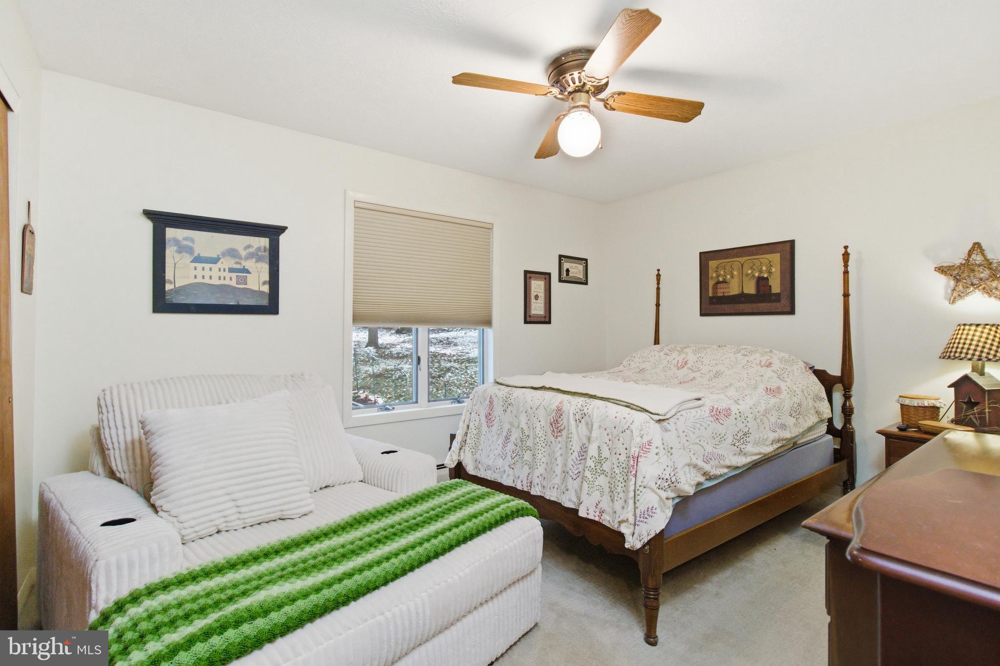 63 Sea Horse Road Du Bois, PA 15801 - Photo 27 of 35 a bedroom with a large bed and a chandelier