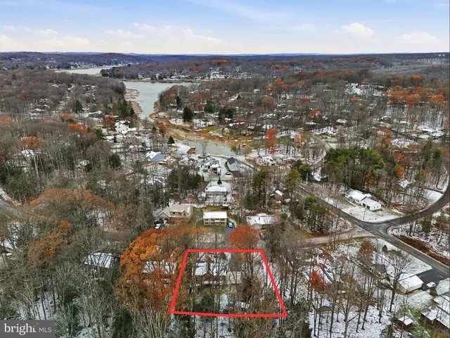 a view of a house with a yard and tree s
