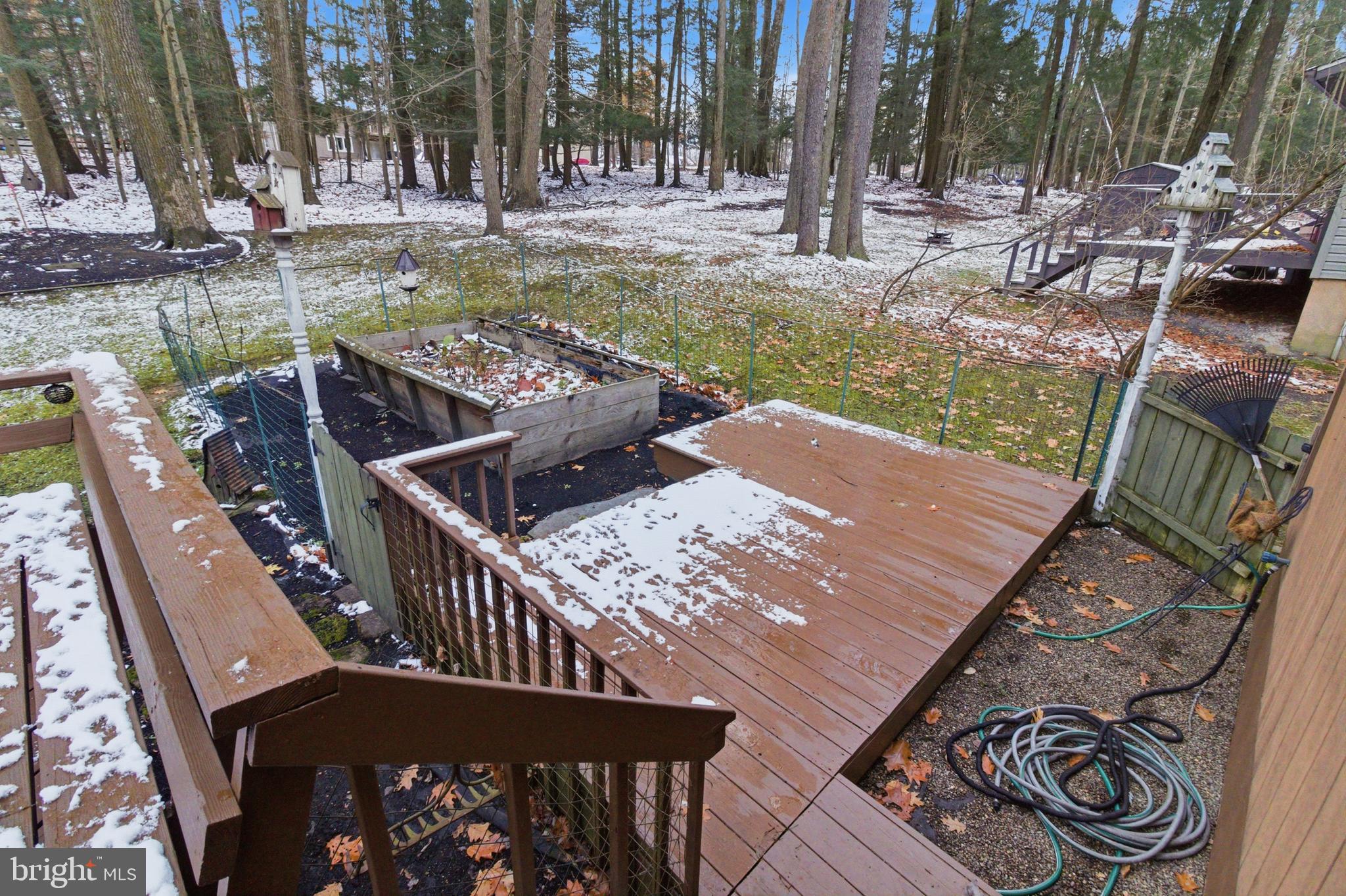 63 Sea Horse Road Du Bois, PA 15801 - Photo 10 of 35 a view of a wooden deck and a patio with swimming pool