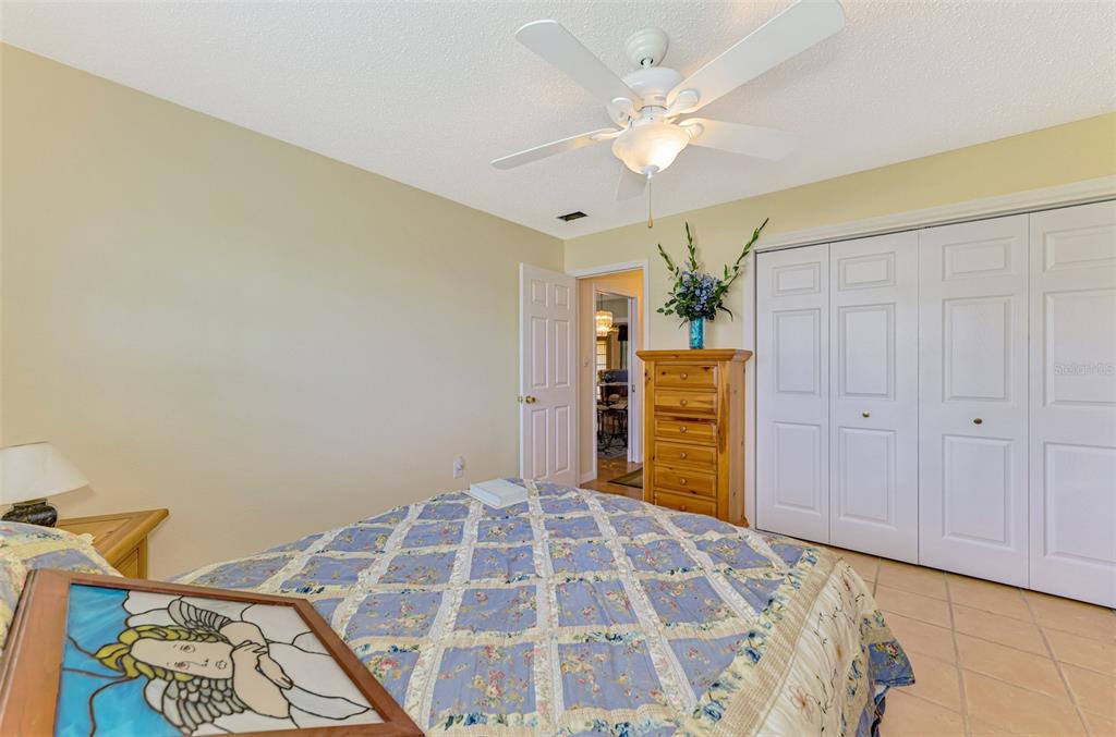 1137 Ponderosa Road Venice, FL 34293 - Photo 33 of 48 a bedroom with a bed and a chandelier