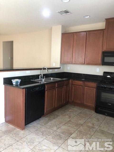 8985 Convair Way Reno, NV 89506 - Photo 3 of 17 a kitchen with a sink and cabinets