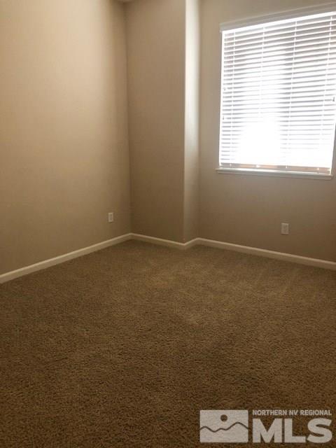8985 Convair Way Reno, NV 89506 - Photo 8 of 17 an empty room with a window