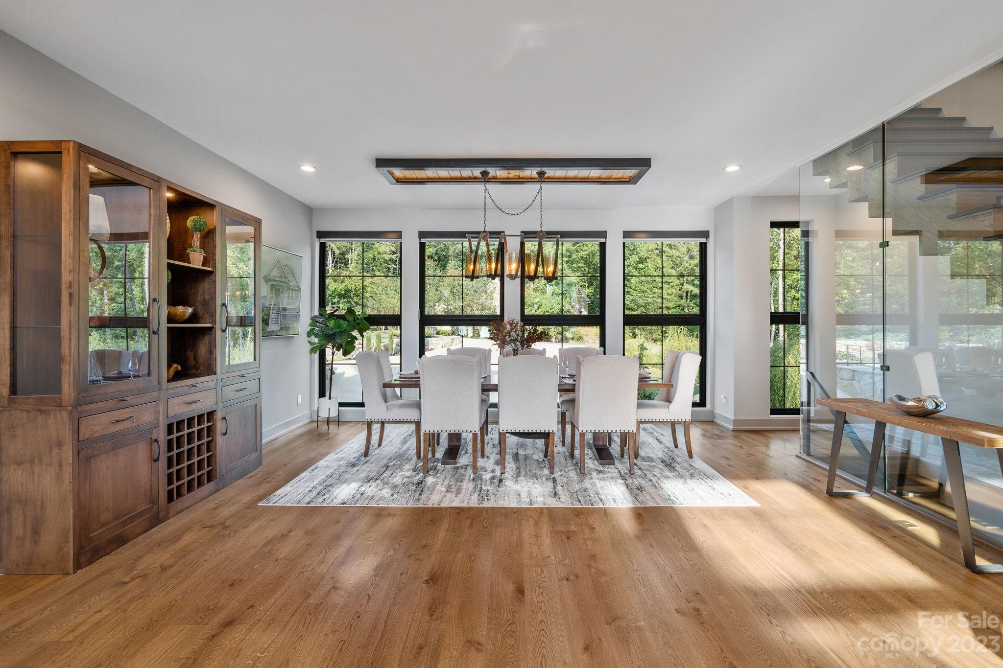 222 Greenbay Road Mooresville, NC 28117 - Photo 12 of 44 a view of a dining room with furniture window and wooden floor
