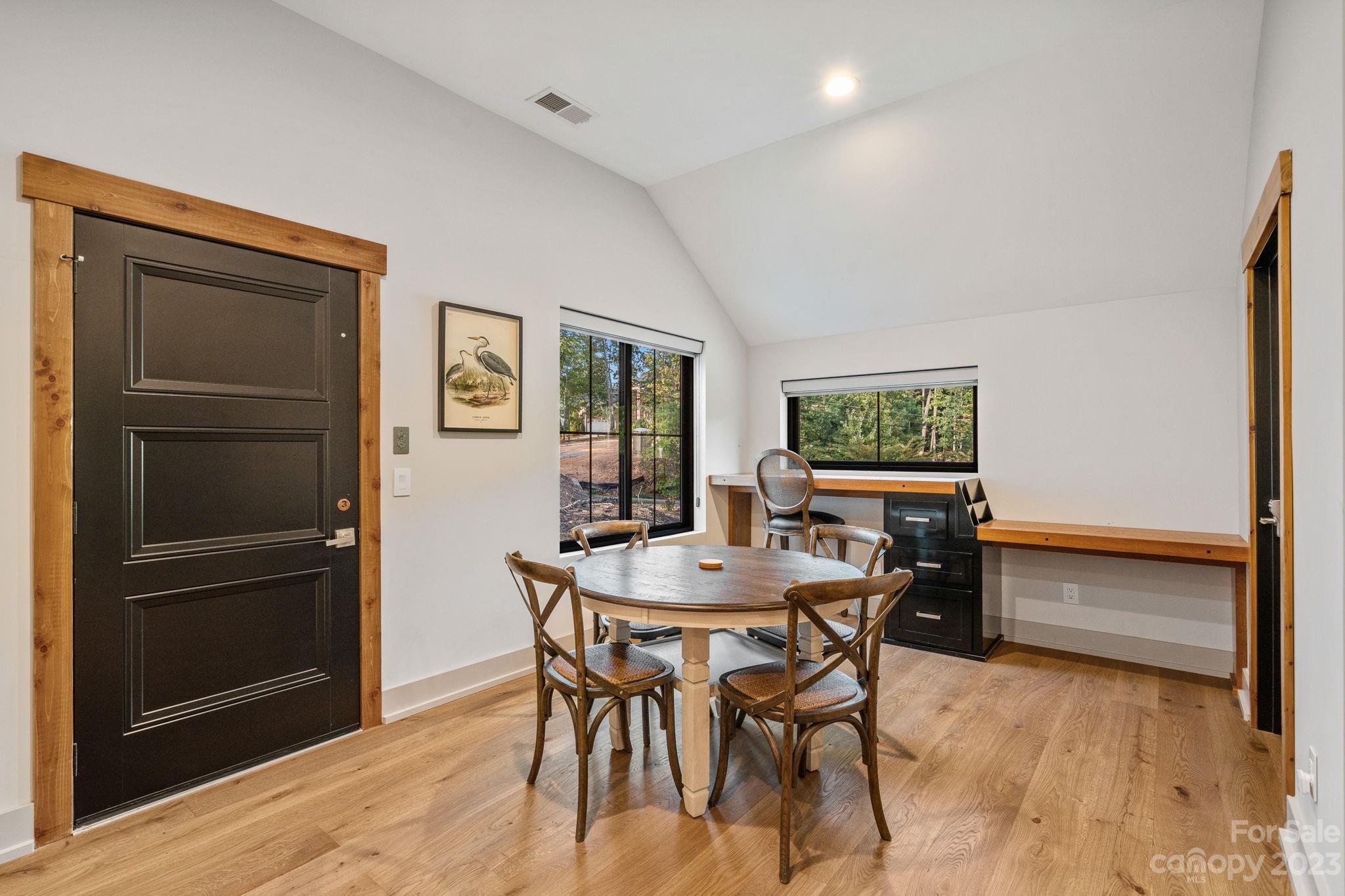 222 Greenbay Road Mooresville, NC 28117 - Photo 20 of 44 a view of a dining room with furniture and a wooden floor