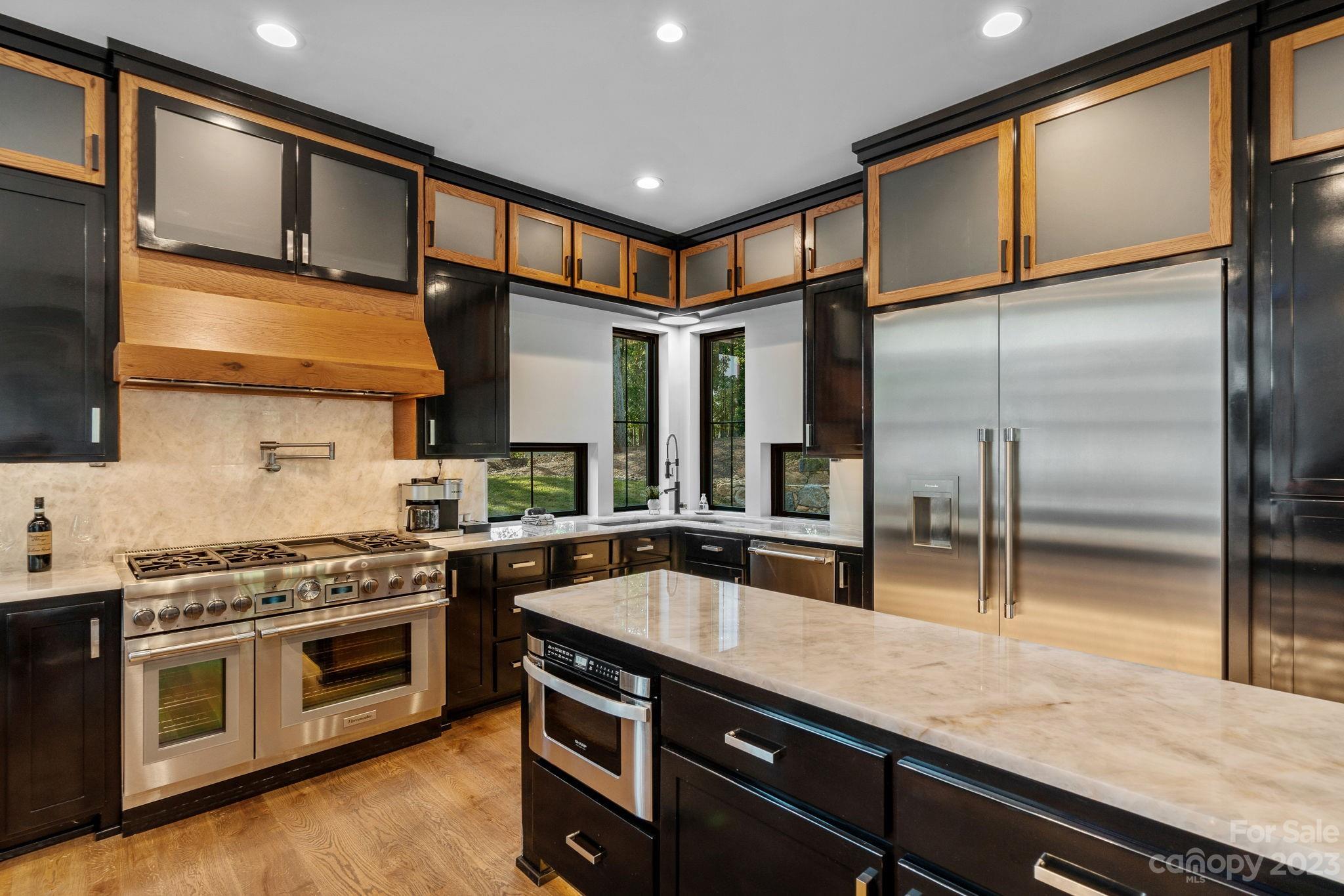 222 Greenbay Road Mooresville, NC 28117 - Photo 10 of 44 a kitchen with stainless steel appliances granite countertop a stove a sink and a refrigerator