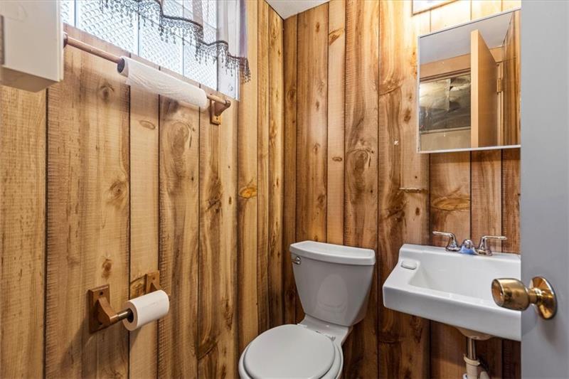 13733 Ormsby Drive Irwin, PA 15642 - Photo 16 of 24 a bathroom with a sink a toilet and shower curtain