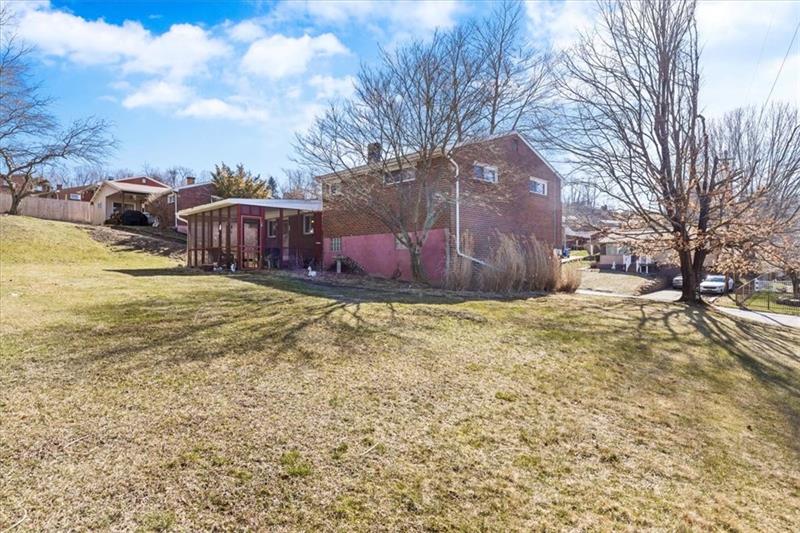 13733 Ormsby Drive Irwin, PA 15642 - Photo 20 of 24 a view of a backyard with large tree