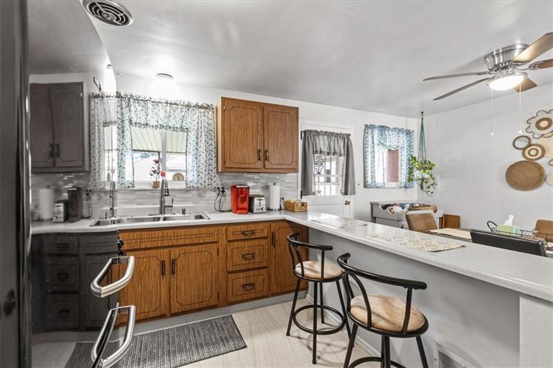 13733 Ormsby Drive Irwin, PA 15642 - Photo 8 of 24 a kitchen with a sink stove and cabinets