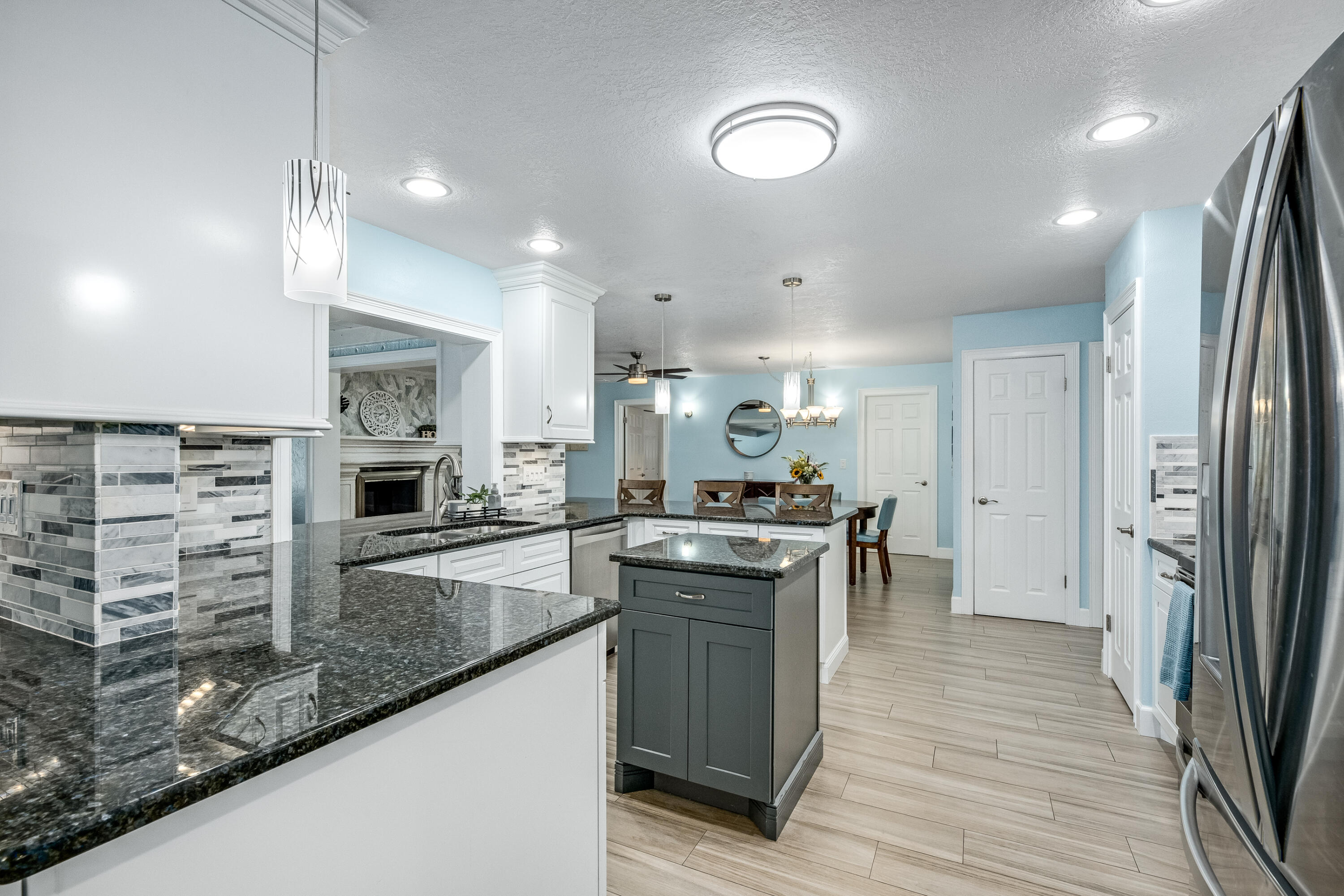 415 Wayne Avenue Indialantic, FL 32903 - Photo 11 of 63 a kitchen with stainless steel appliances granite countertop a sink stove and refrigerator