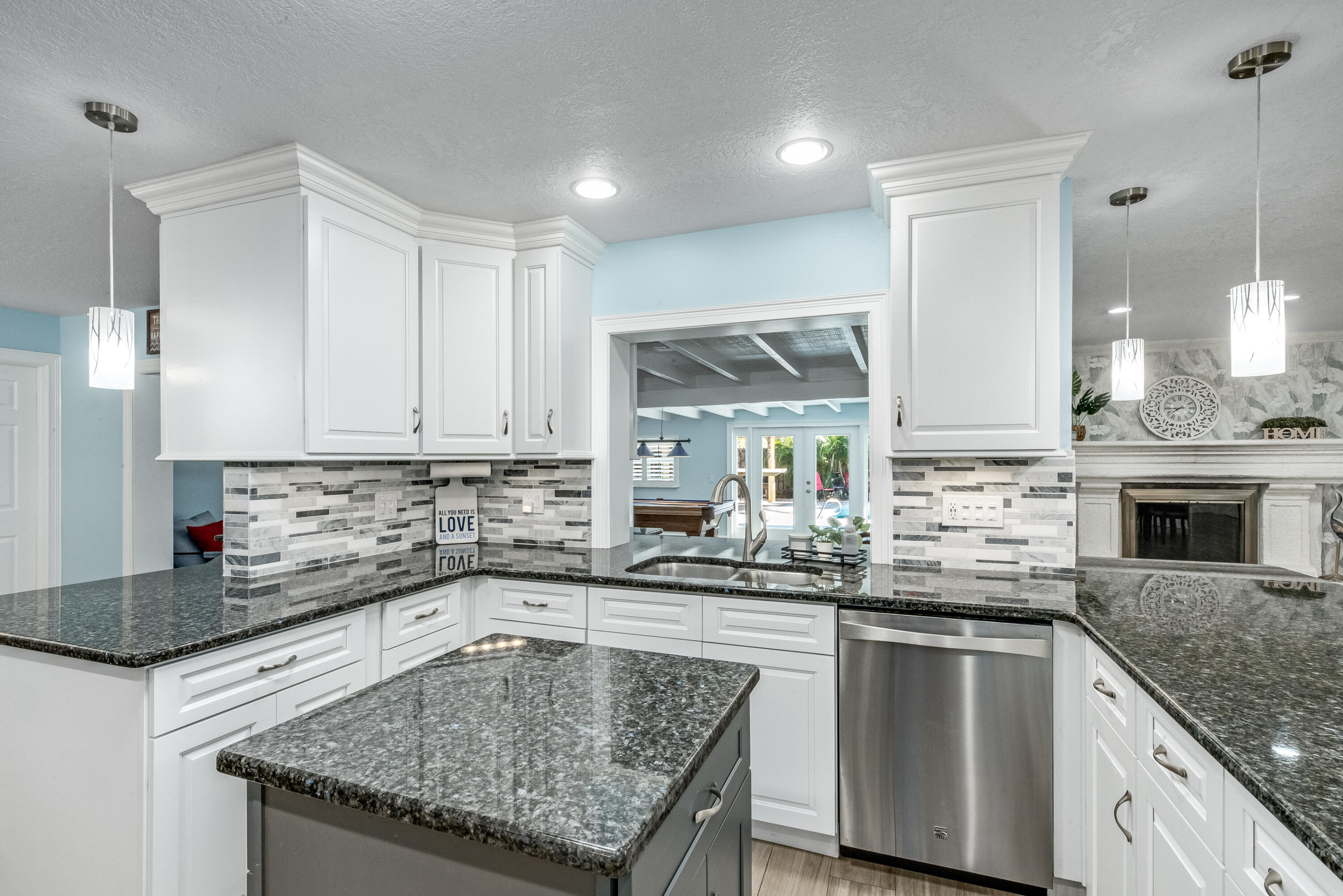 415 Wayne Avenue Indialantic, FL 32903 - Photo 14 of 63 a kitchen with stainless steel appliances granite countertop a sink stove and cabinets