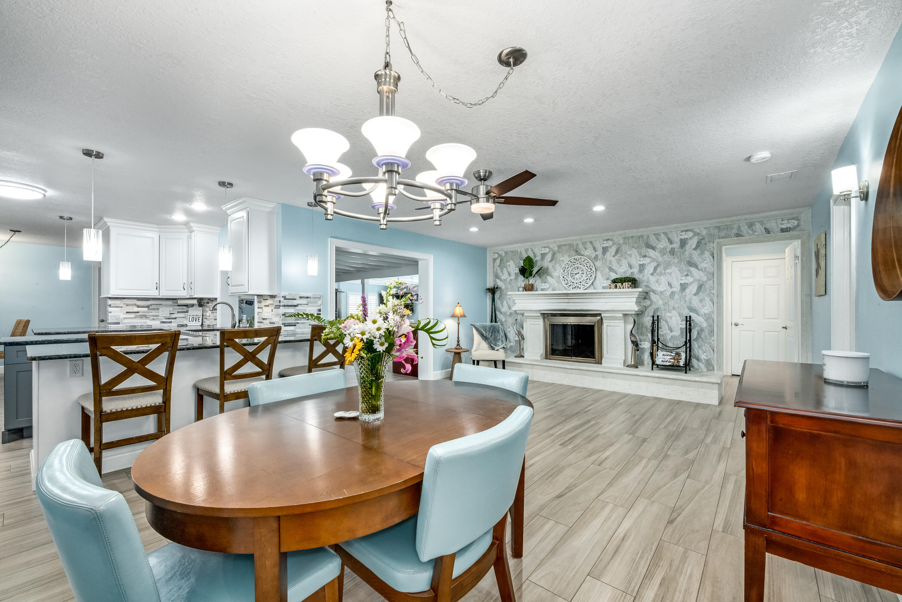 415 Wayne Avenue Indialantic, FL 32903 - Photo 19 of 63 a view of a dining room with furniture wooden floor and chandelier