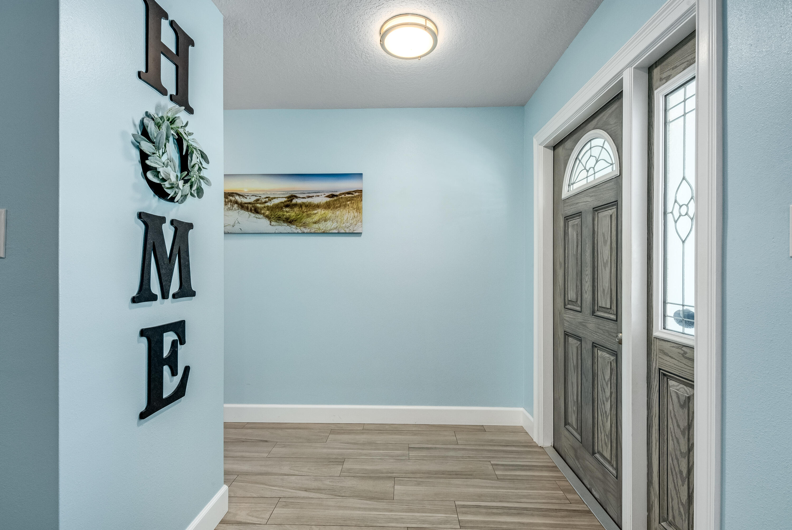 415 Wayne Avenue Indialantic, FL 32903 - Photo 2 of 63 a view of an entryway with wooden floor