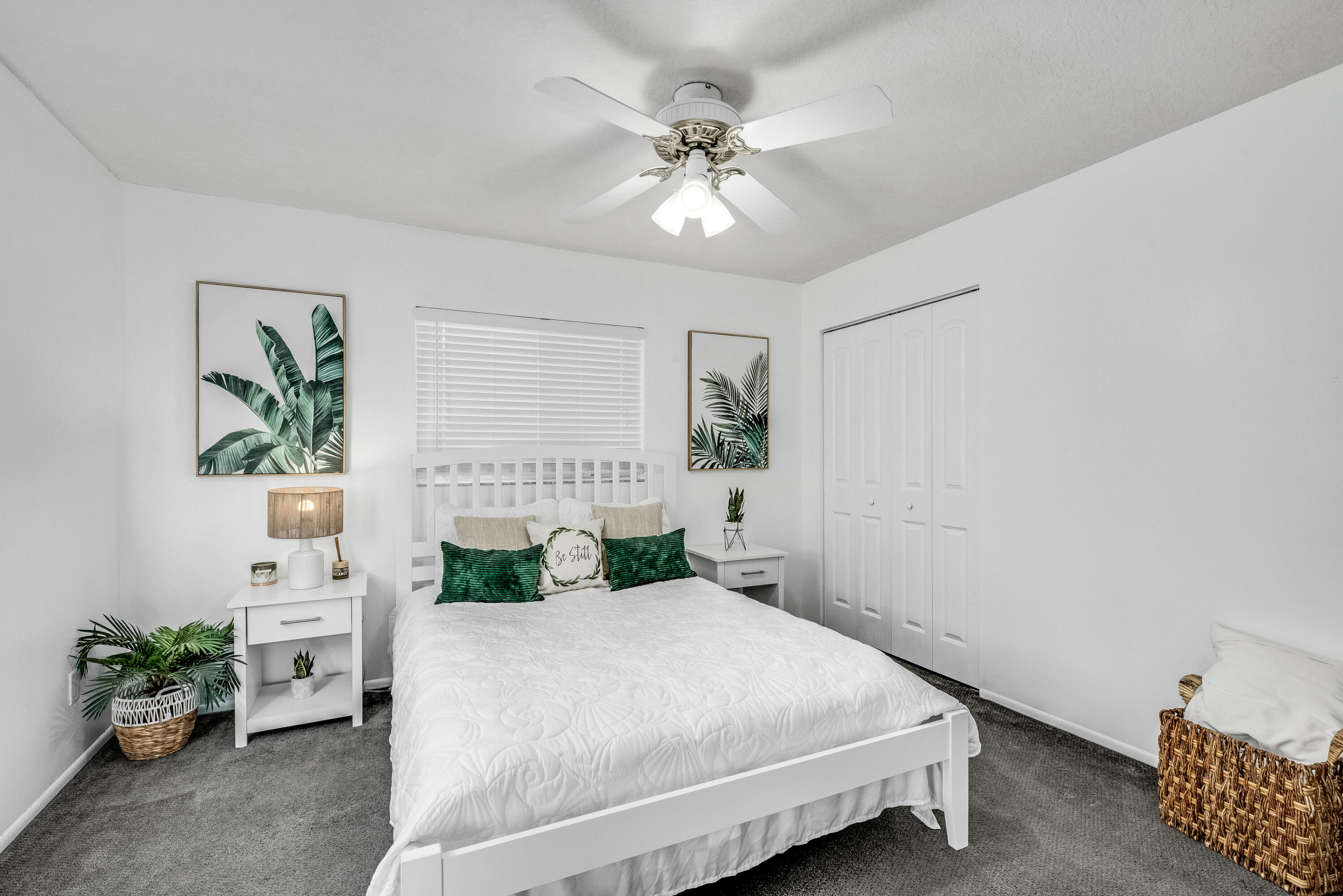 415 Wayne Avenue Indialantic, FL 32903 - Photo 26 of 63 a bedroom with a bed chandelier and a window