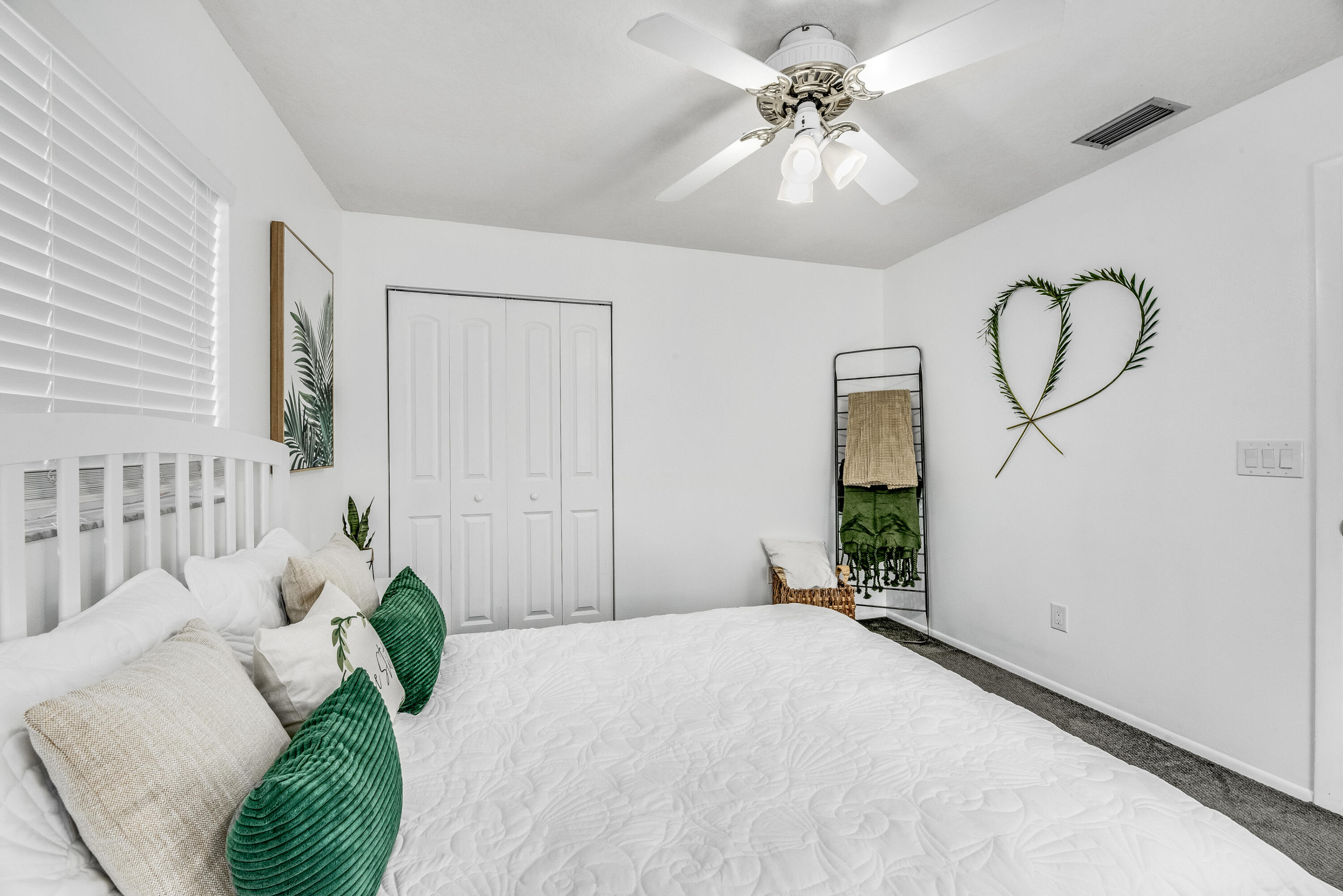 415 Wayne Avenue Indialantic, FL 32903 - Photo 27 of 63 a bedroom with a bed mirror and window