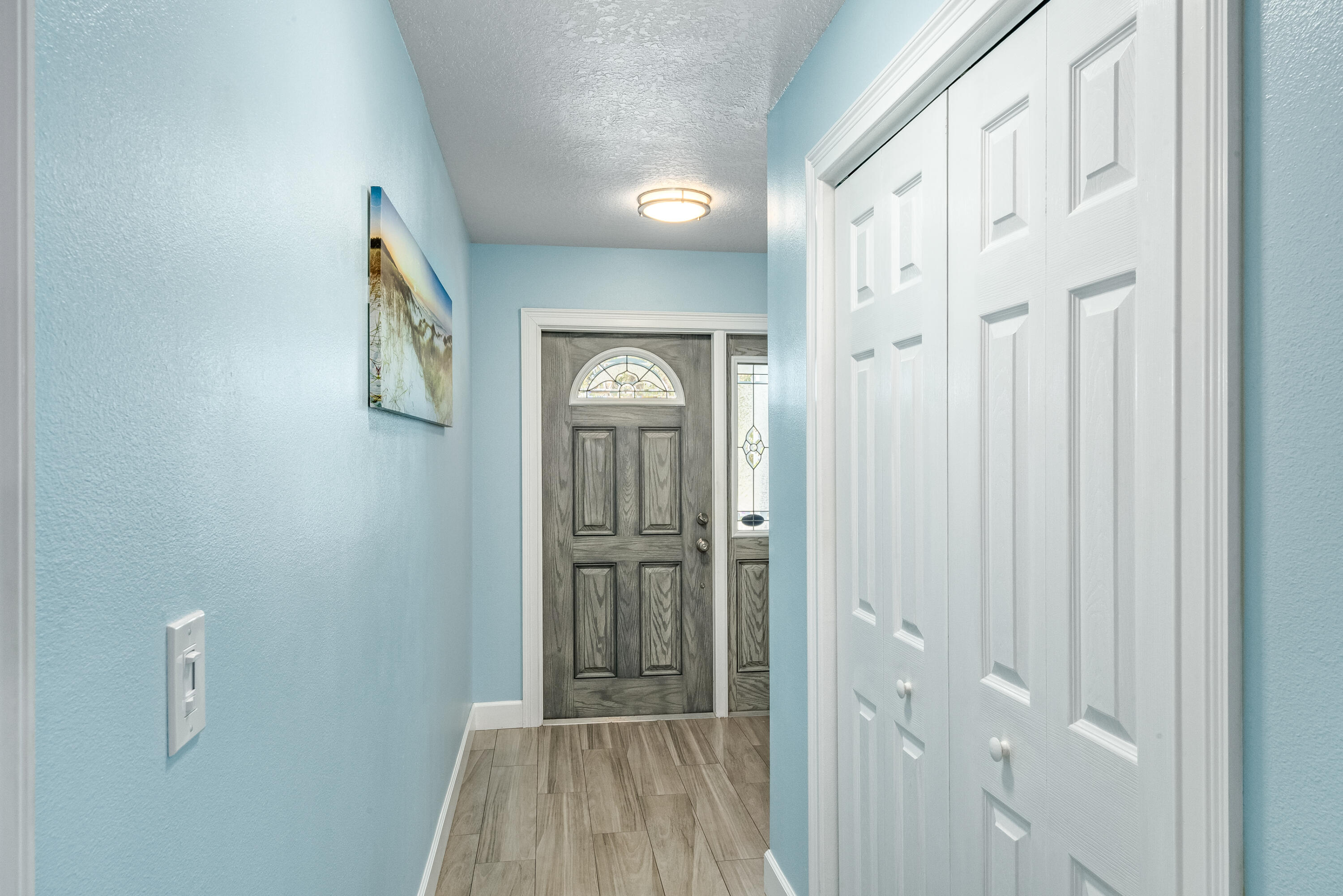 415 Wayne Avenue Indialantic, FL 32903 - Photo 3 of 63 a view of a hallway with wooden floor