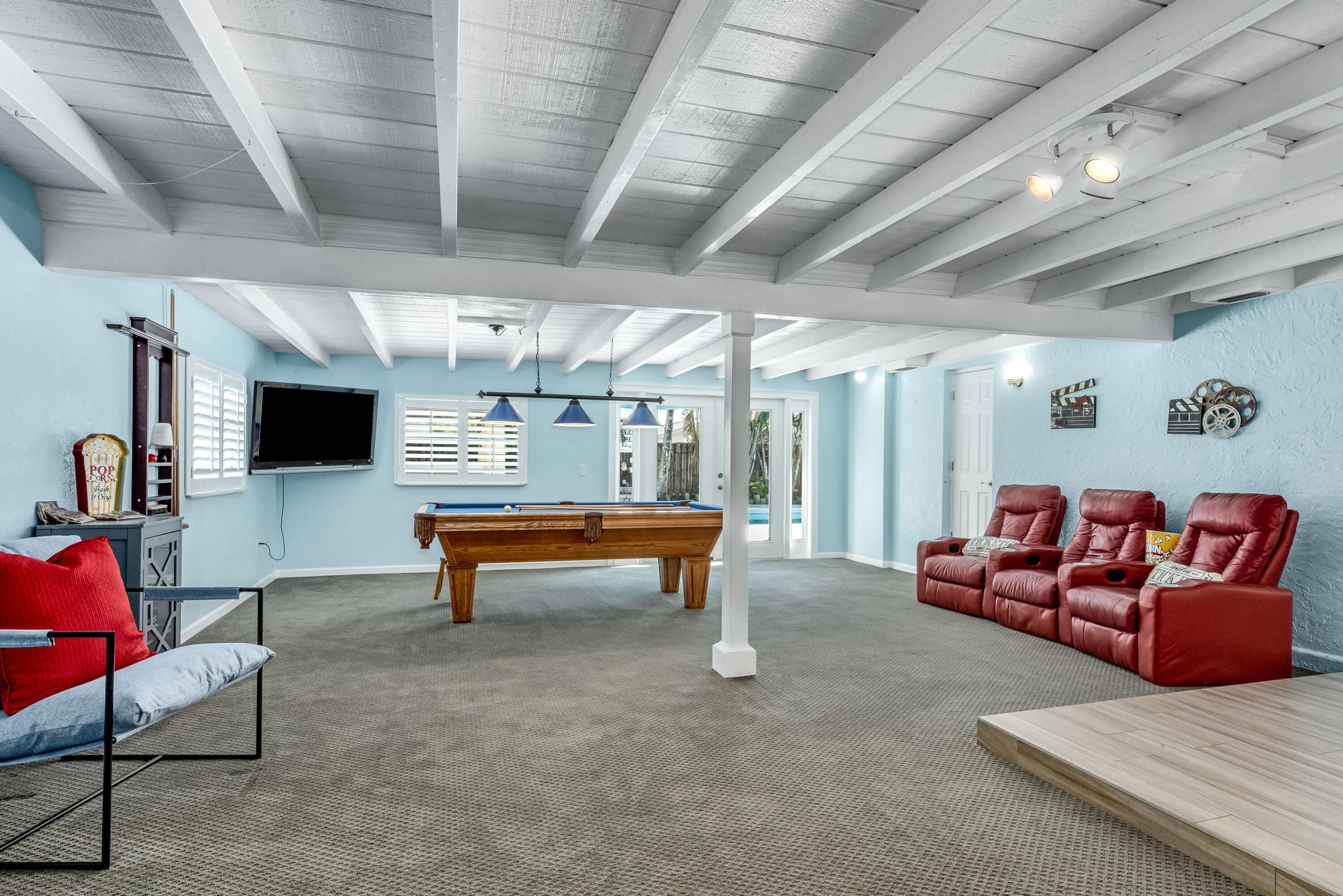 415 Wayne Avenue Indialantic, FL 32903 - Photo 36 of 63 a living room with furniture and a flat screen tv