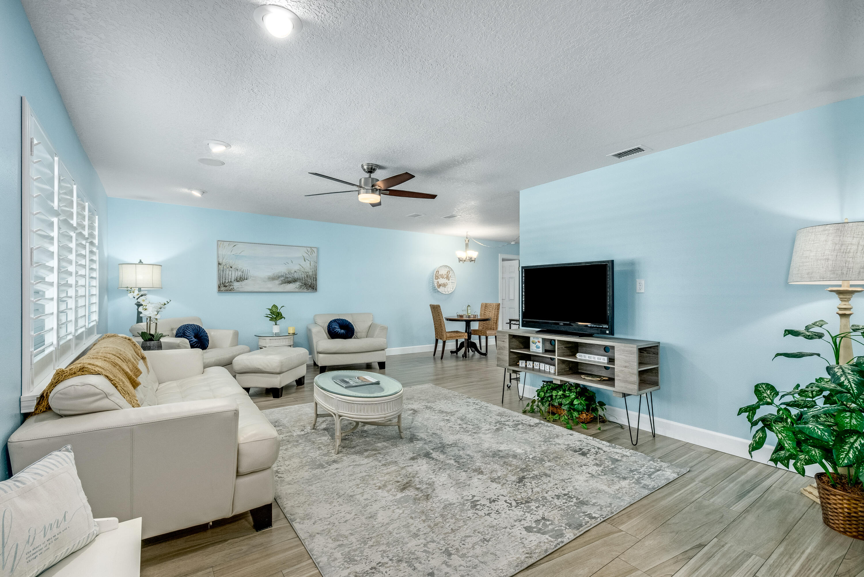 415 Wayne Avenue Indialantic, FL 32903 - Photo 4 of 63 a living room with furniture and a flat screen tv