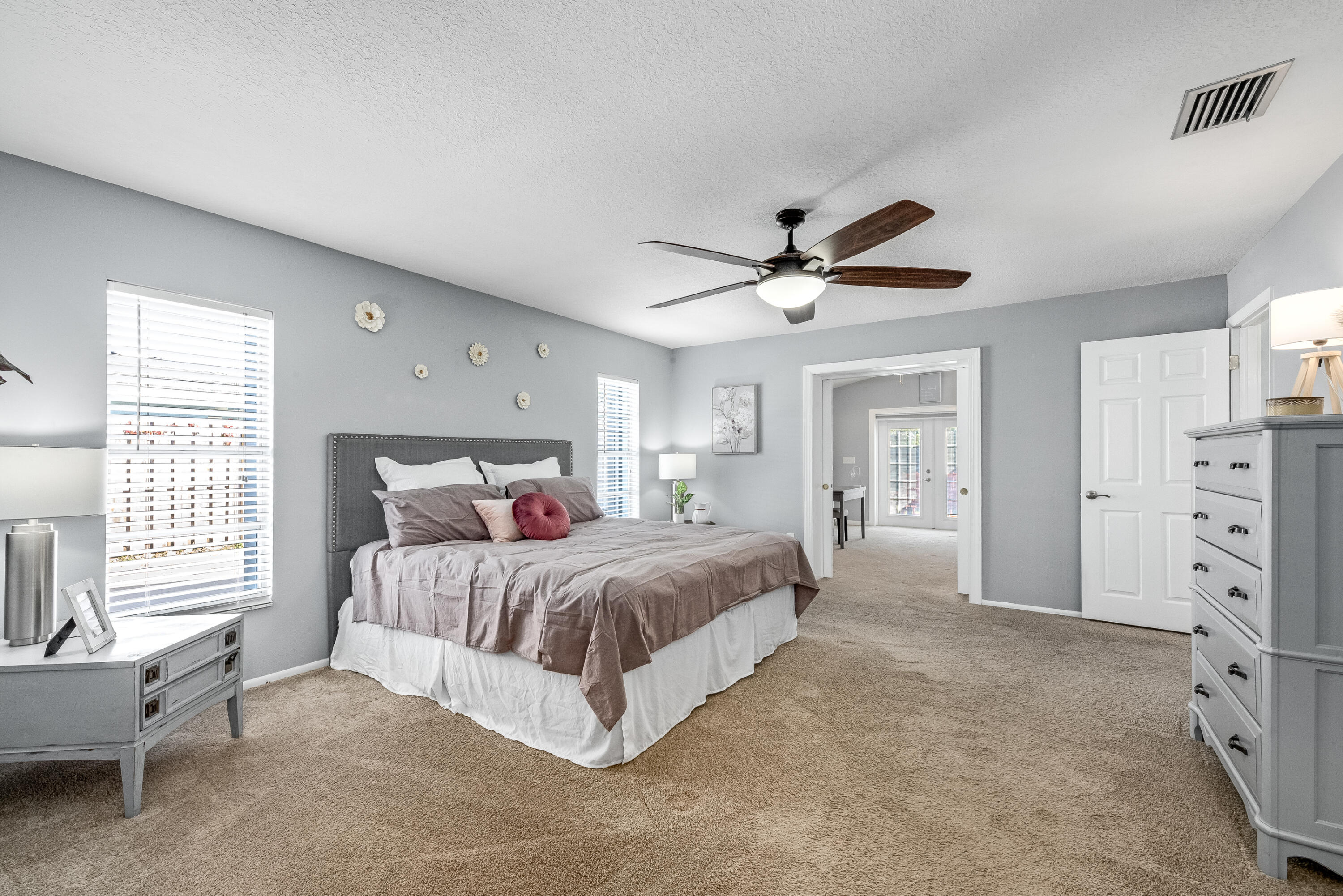 415 Wayne Avenue Indialantic, FL 32903 - Photo 44 of 63 a spacious bedroom with a bed and window