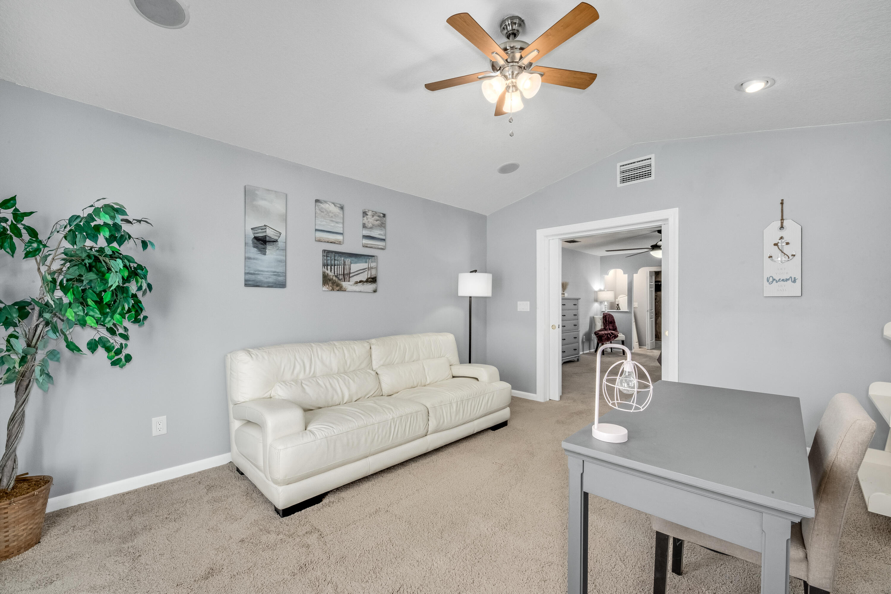 415 Wayne Avenue Indialantic, FL 32903 - Photo 46 of 63 a living room with furniture and a chandelier