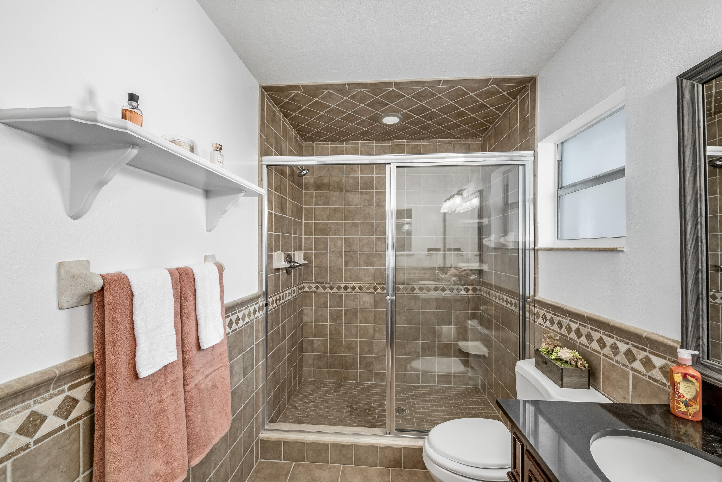 415 Wayne Avenue Indialantic, FL 32903 - Photo 48 of 63 a bathroom with a shower and toilet