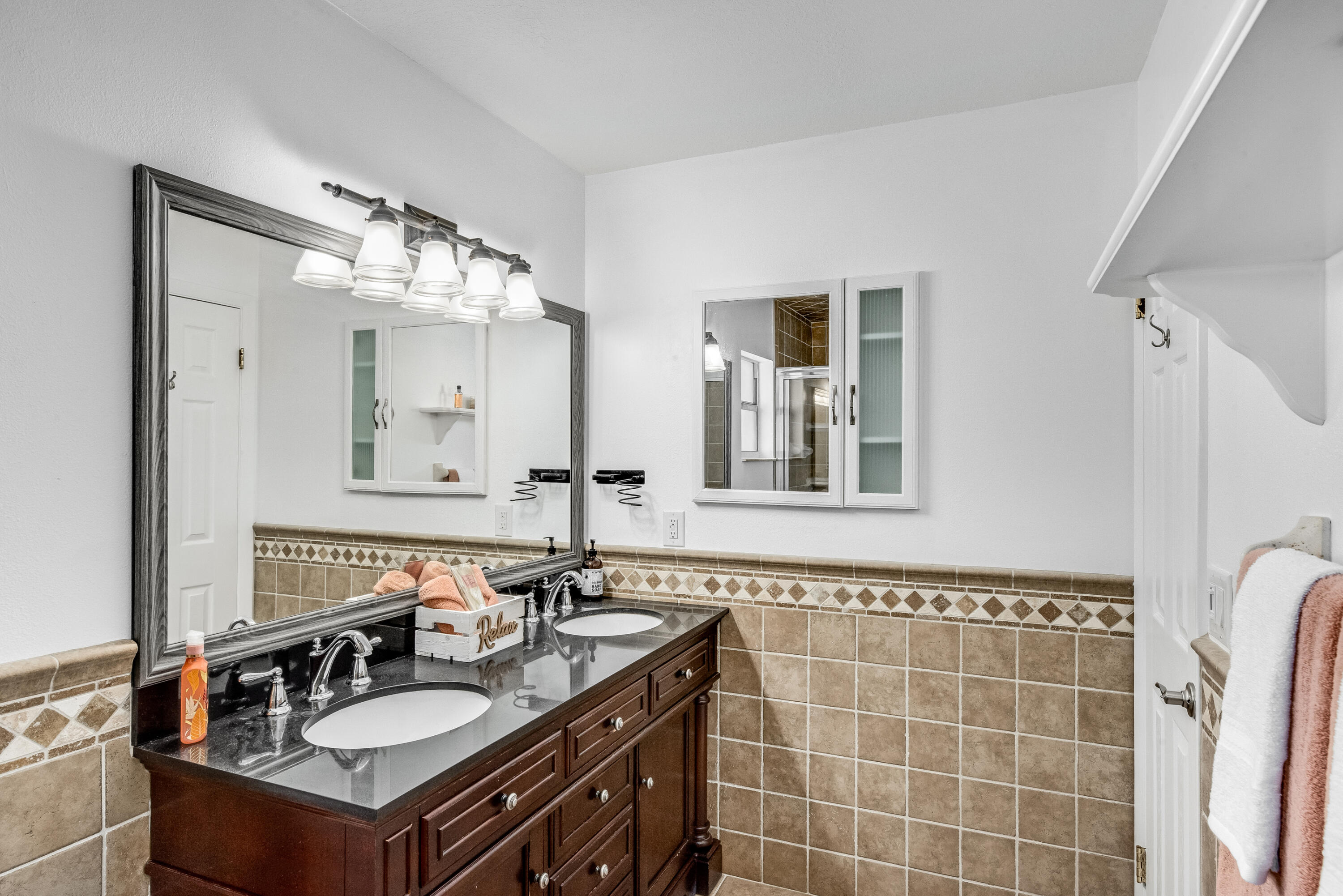 415 Wayne Avenue Indialantic, FL 32903 - Photo 49 of 63 a bathroom with a sink vanity and a mirror