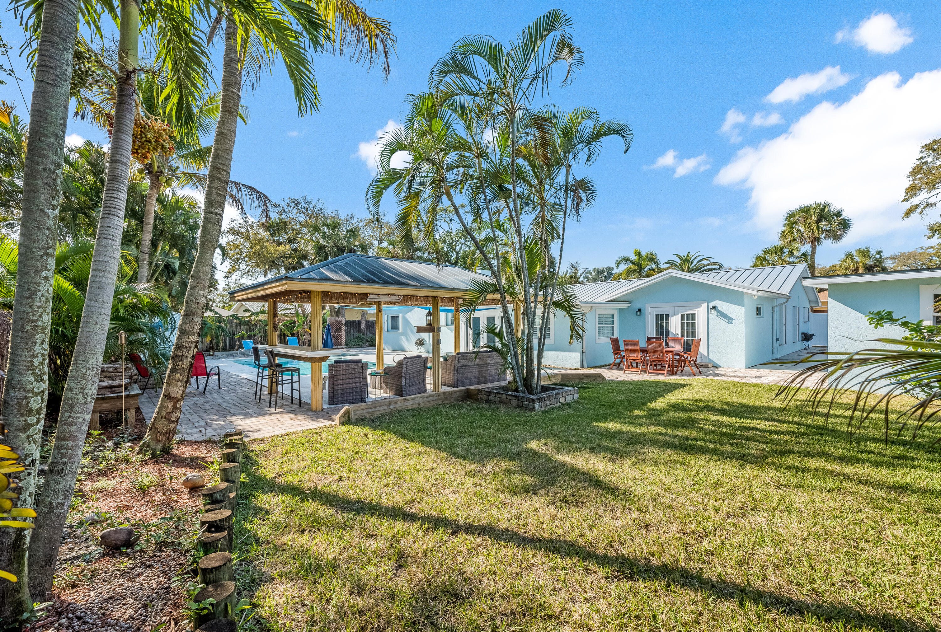 415 Wayne Avenue Indialantic, FL 32903 - Photo 59 of 63 a view of a house with a yard patio and sitting area