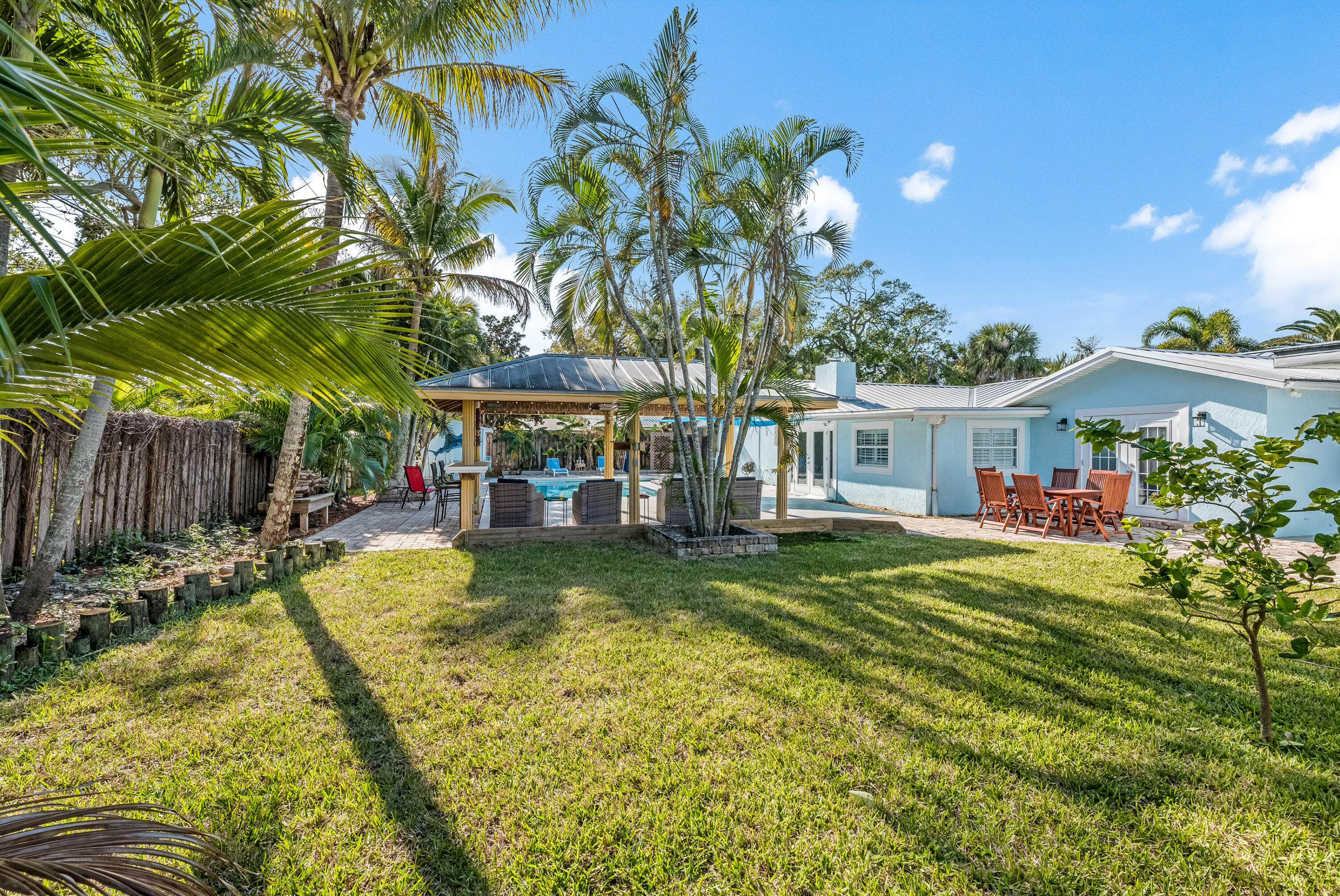 415 Wayne Avenue Indialantic, FL 32903 - Photo 60 of 63 a view of a house with swimming pool and sitting area