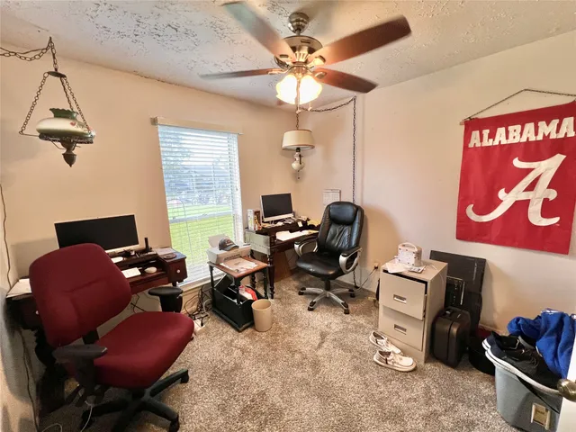 a room with gym equipment and a window
