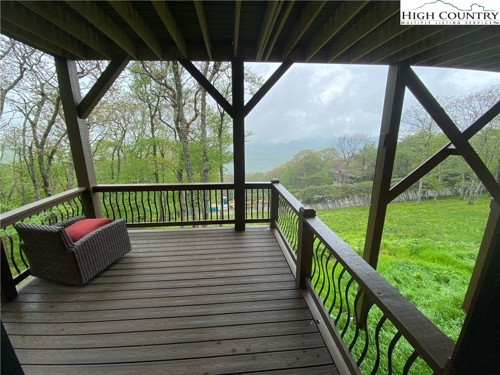 543 Broken Arrow Trail Boone, NC 28607 - Photo 11 of 35 a view of balcony with couch and wooden floor