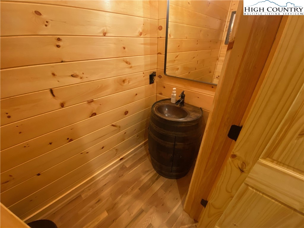 543 Broken Arrow Trail Boone, NC 28607 - Photo 12 of 35 a bathroom with a sink and a shower curtain