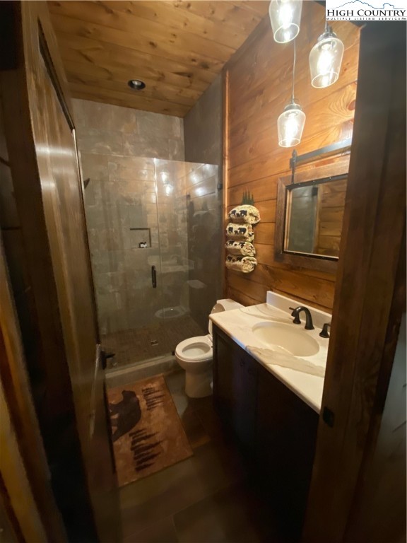 543 Broken Arrow Trail Boone, NC 28607 - Photo 20 of 35 a bathroom with a sink a toilet and shower