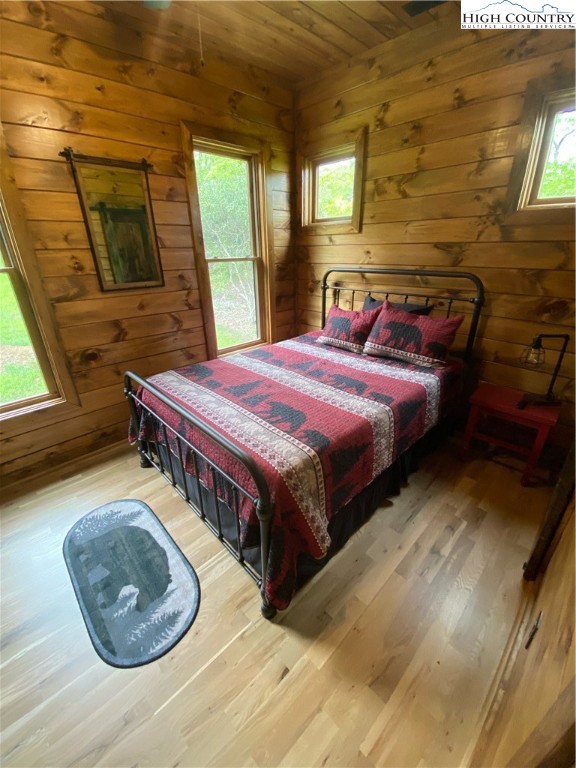 543 Broken Arrow Trail Boone, NC 28607 - Photo 21 of 35 a bedroom with a bed and a couch